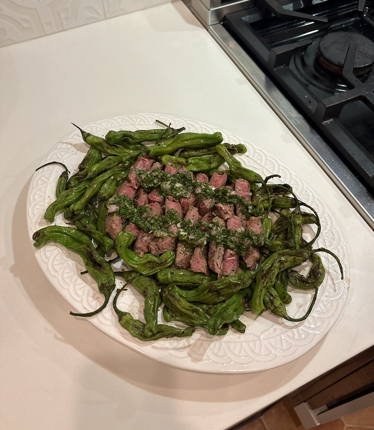New York strip with cilantro chimichurri and ponzu shishito Peppers 