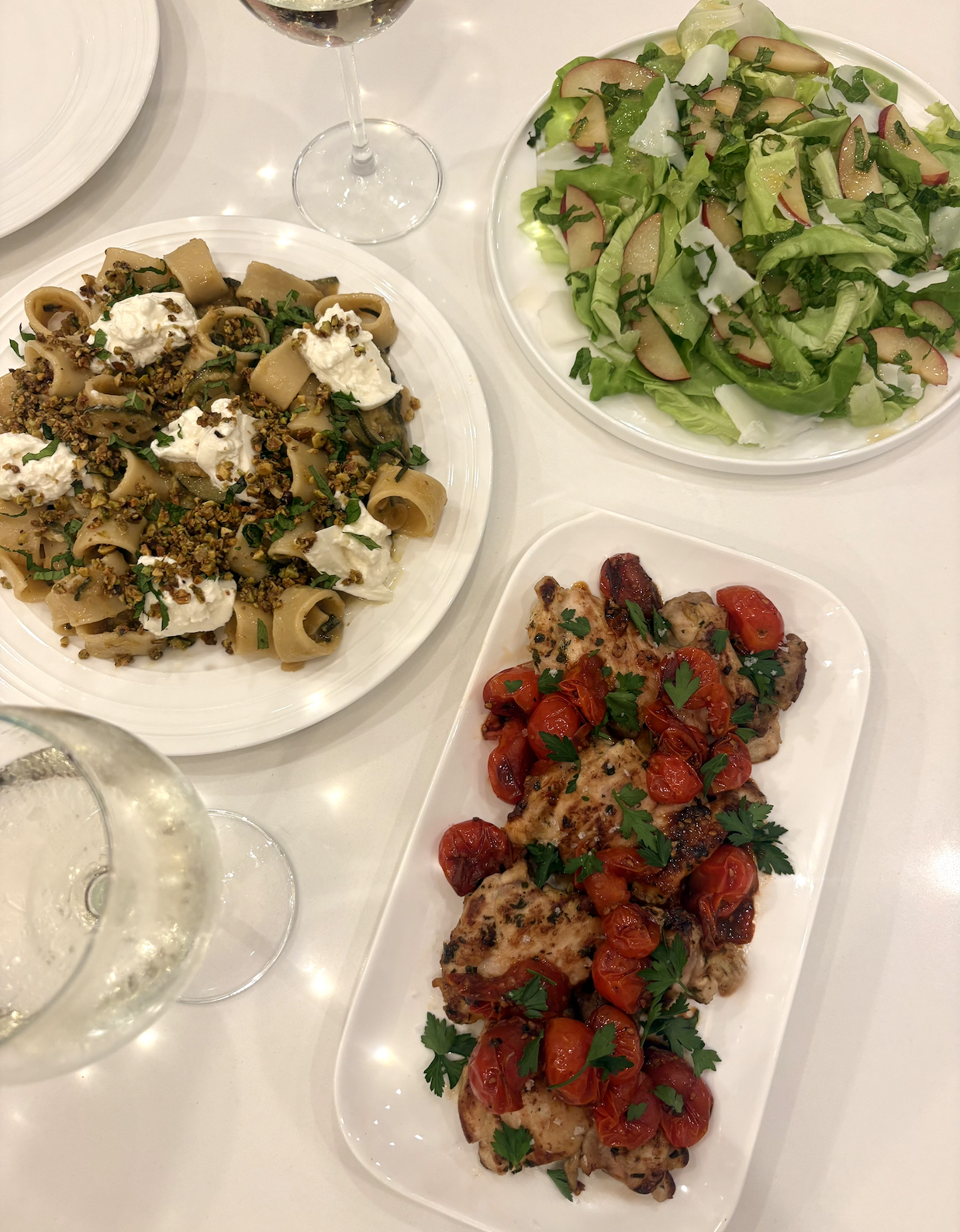 Caramelized zucchini, shallot, & lemon pasta topped with burrata, toasted pistachios, and fresh mint. 
Grilled chicken thighs with blistered cherry tomatoes.
Butter lettuce with red plums & shaved goat gouda, tossed in a lemon vinaigrette.