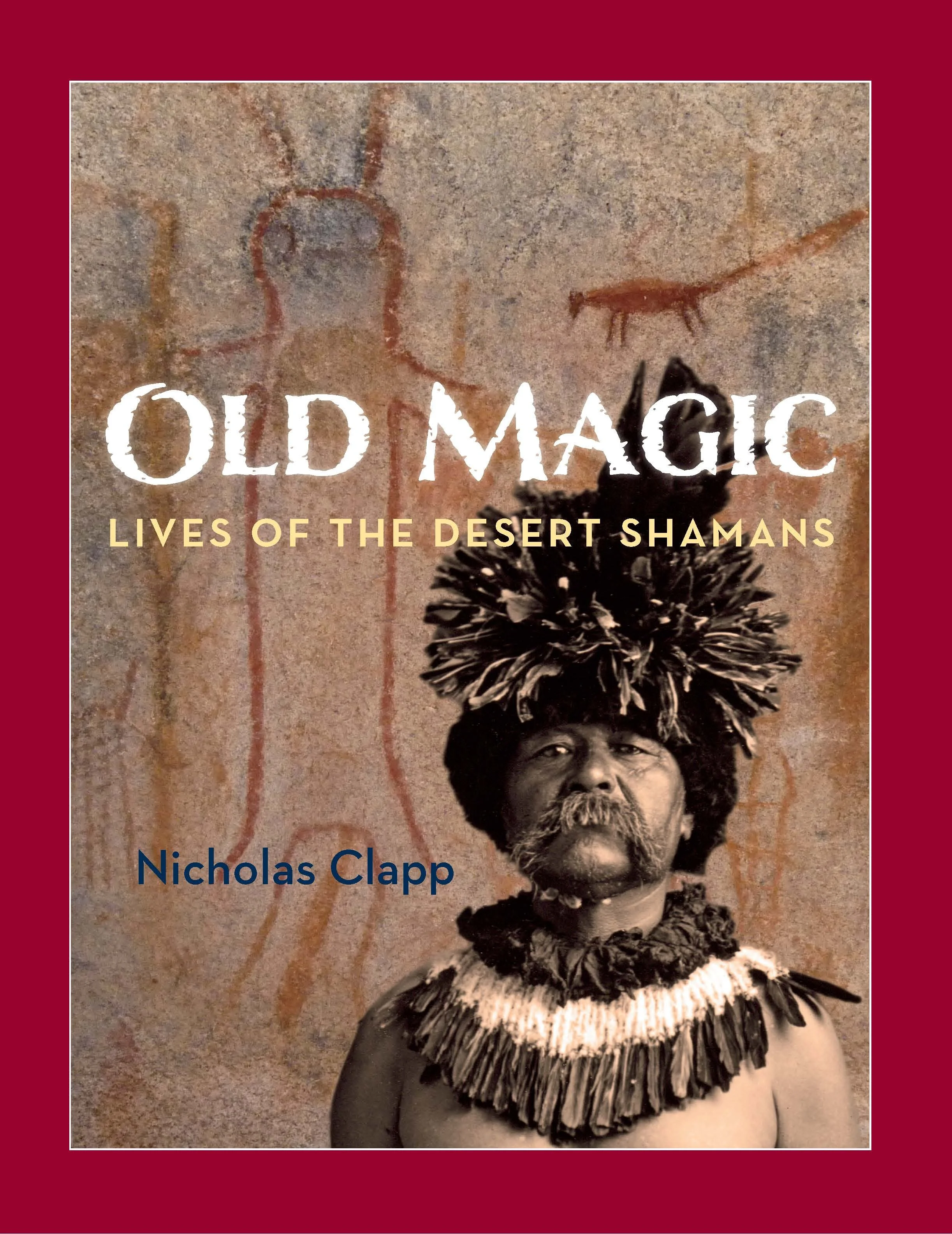 Book cover titled "Old Magic: Lives of the Desert Shamans" by Nicholas Clapp, featuring a photograph of a person with dark hair, wearing traditional costume with a feathered collar, standing against a textured wall with ancient petroglyphs.