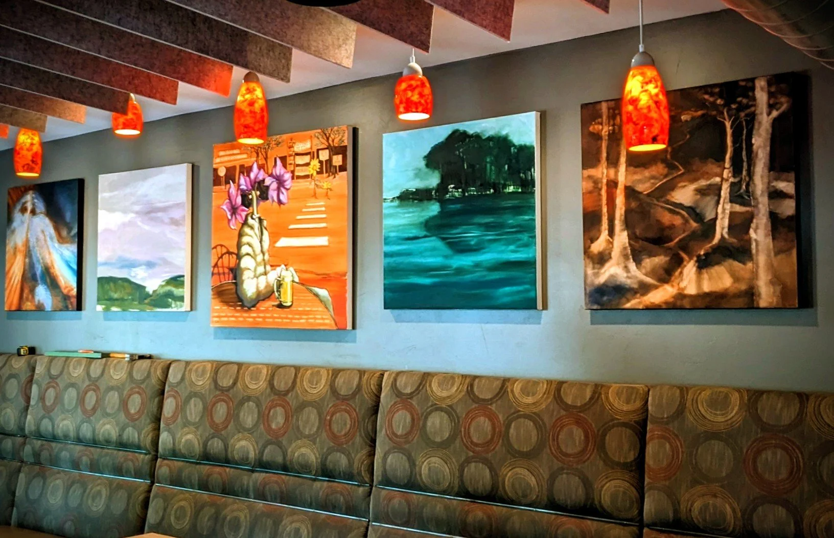Five colorful oil paintings by painter, Cynthia Deswik are displayed on the wall of Cerberus Brewing company, 702 West Colorado Avenue, Colorado Springs CO. Plan a visit today!