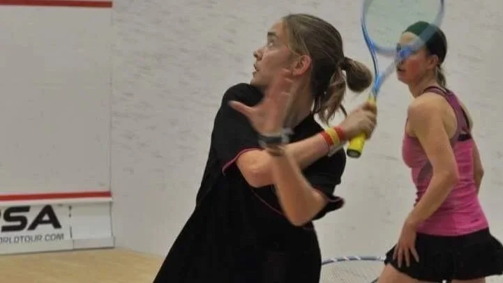 Photo of Marina playing squash.