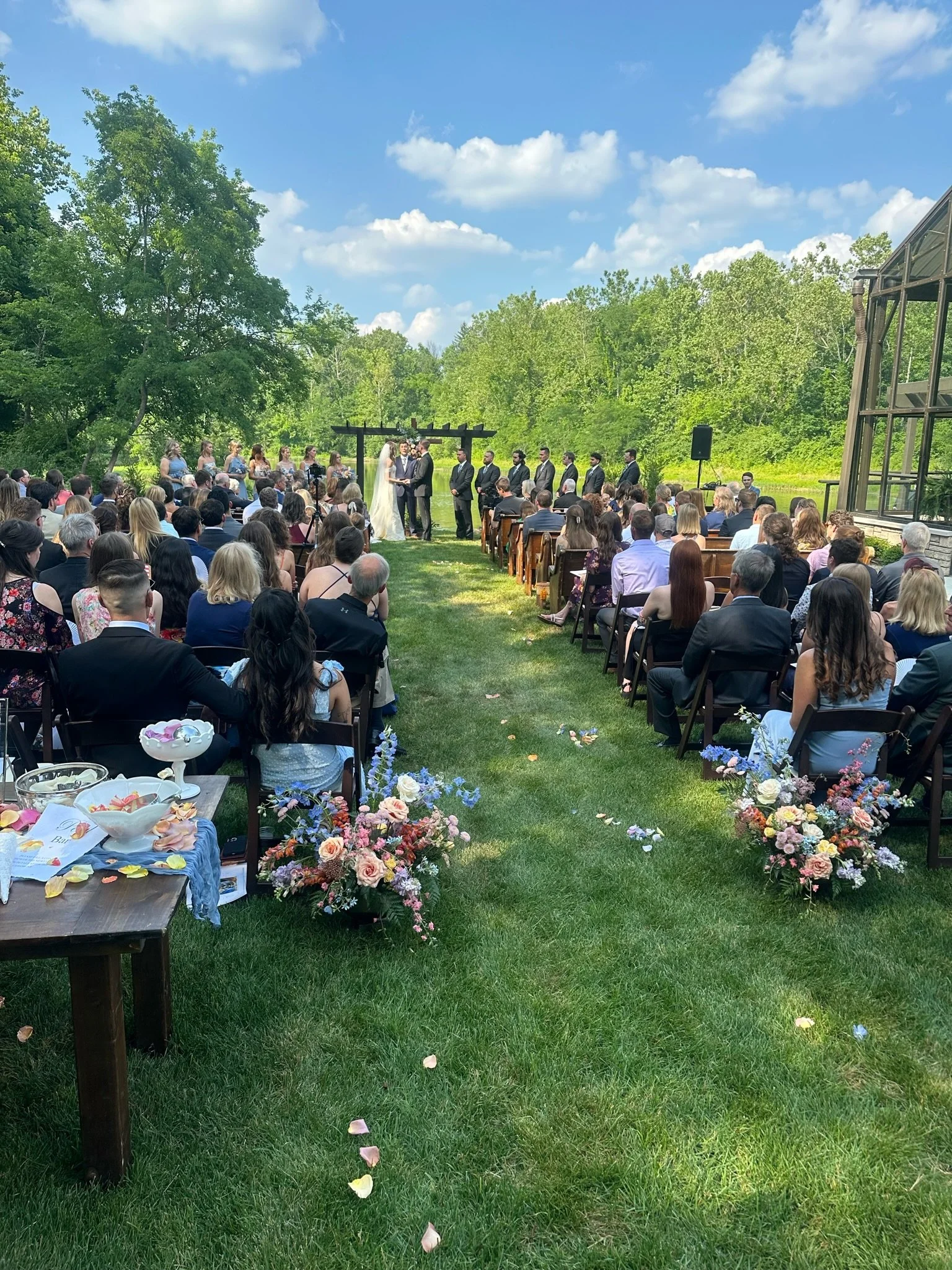 outdoor wedding ceremony at the conservatory at evergreen
