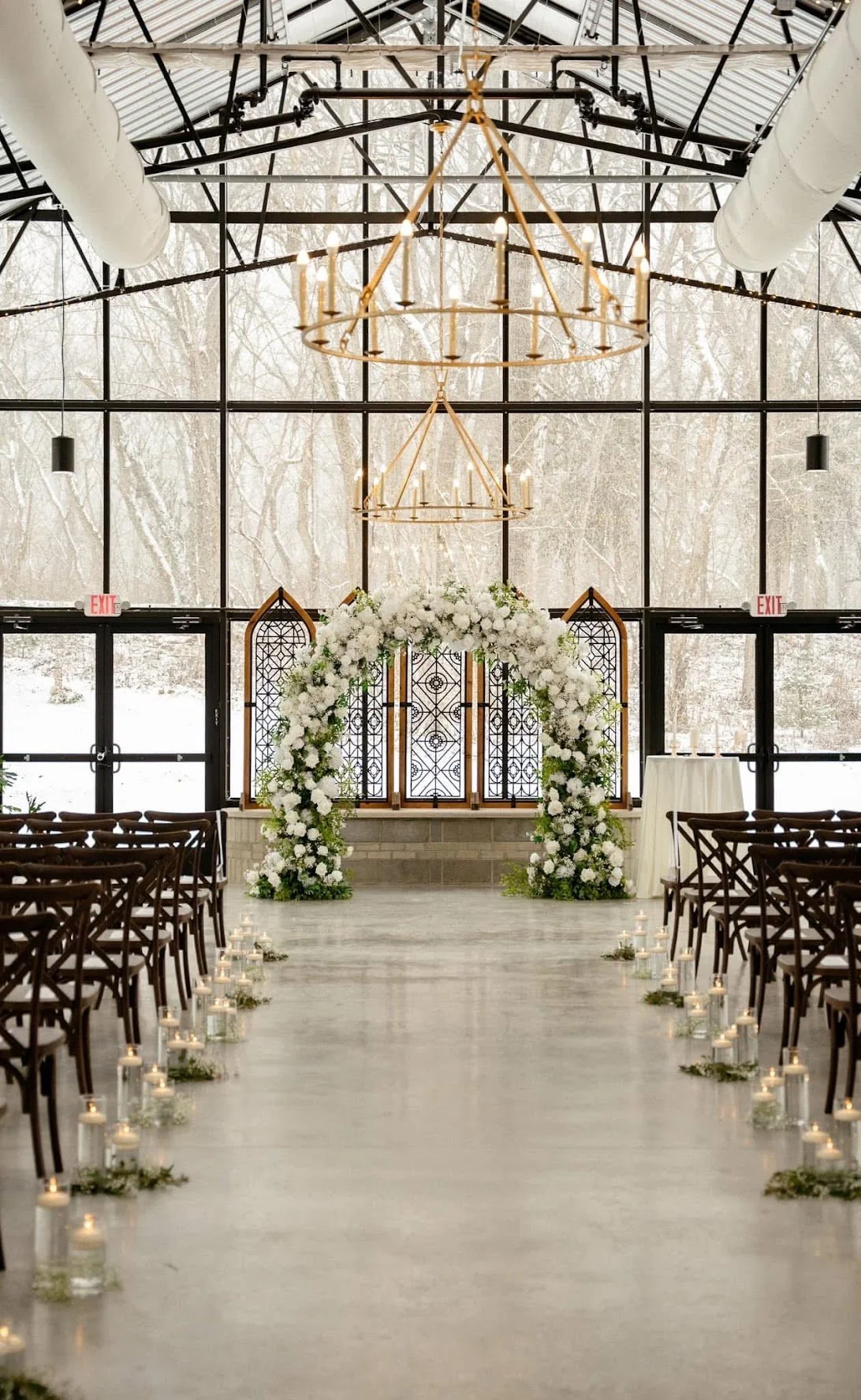 Indoor wedding ceremony in the glass hall at conservatory at evergreen