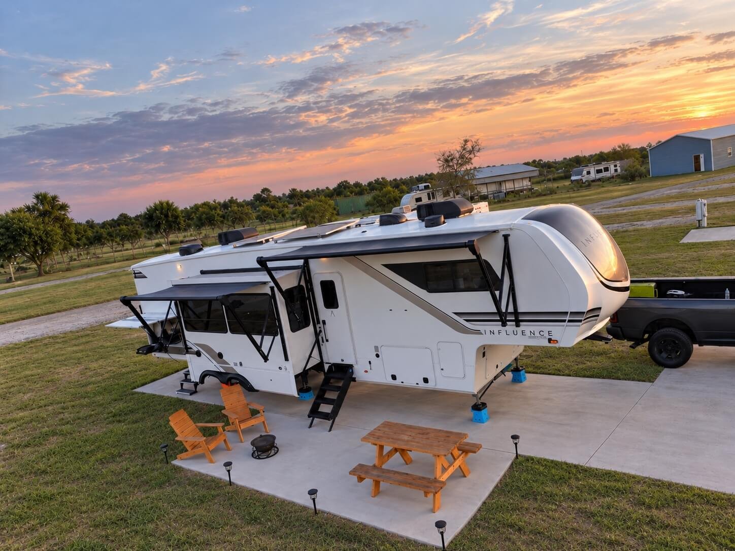 remium full-hookup concrete RV site at The Hideaway RV Retreat, the best RV park in Rockport, Texas, with a fifth-wheel RV, truck parking, patio space and sunset views, creating the perfect base camp for exploring the Texas coast.