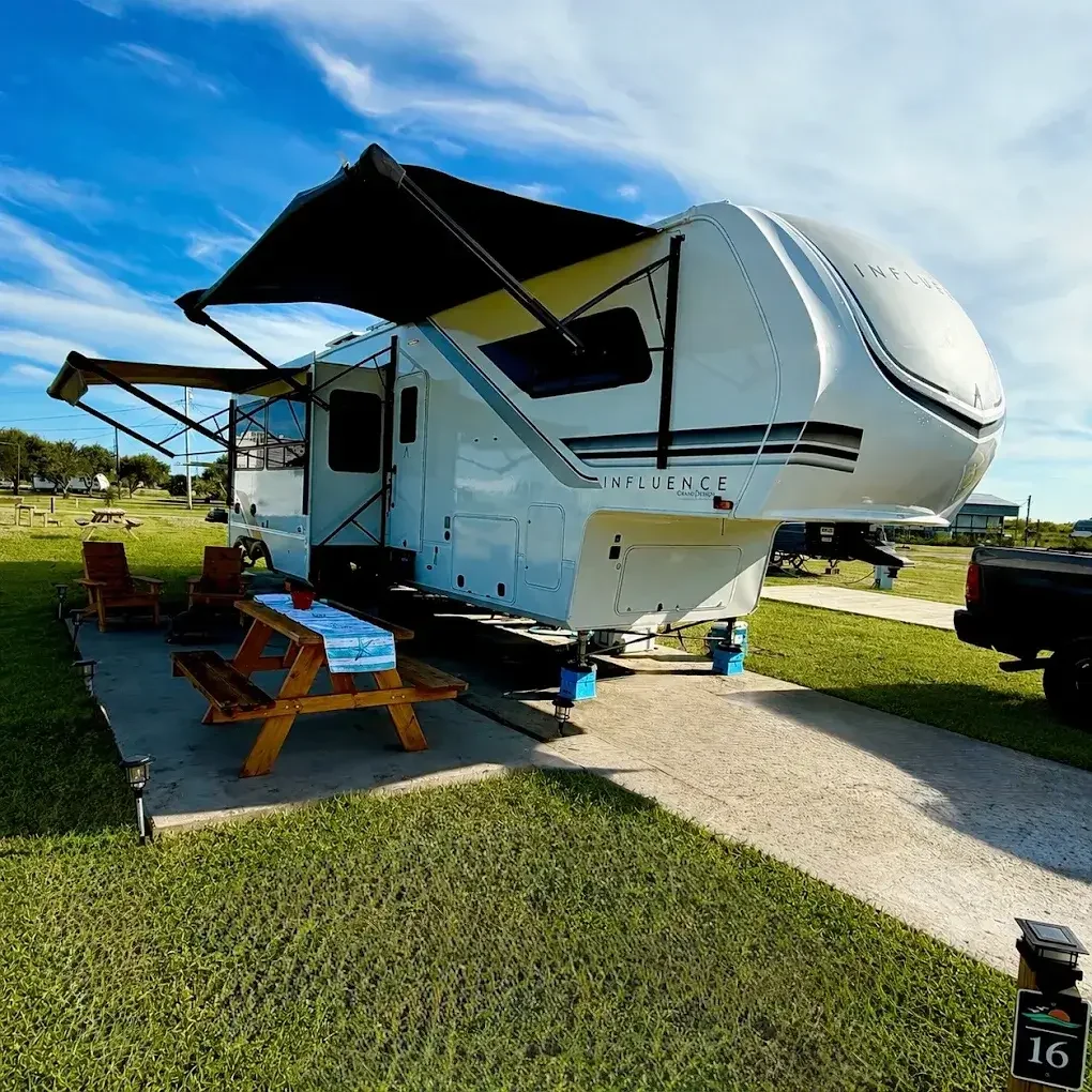 Luxury Grand Design Influence fifth wheel set up for an extended stay at The Hideaway RV Retreat in Rockport, Texas.