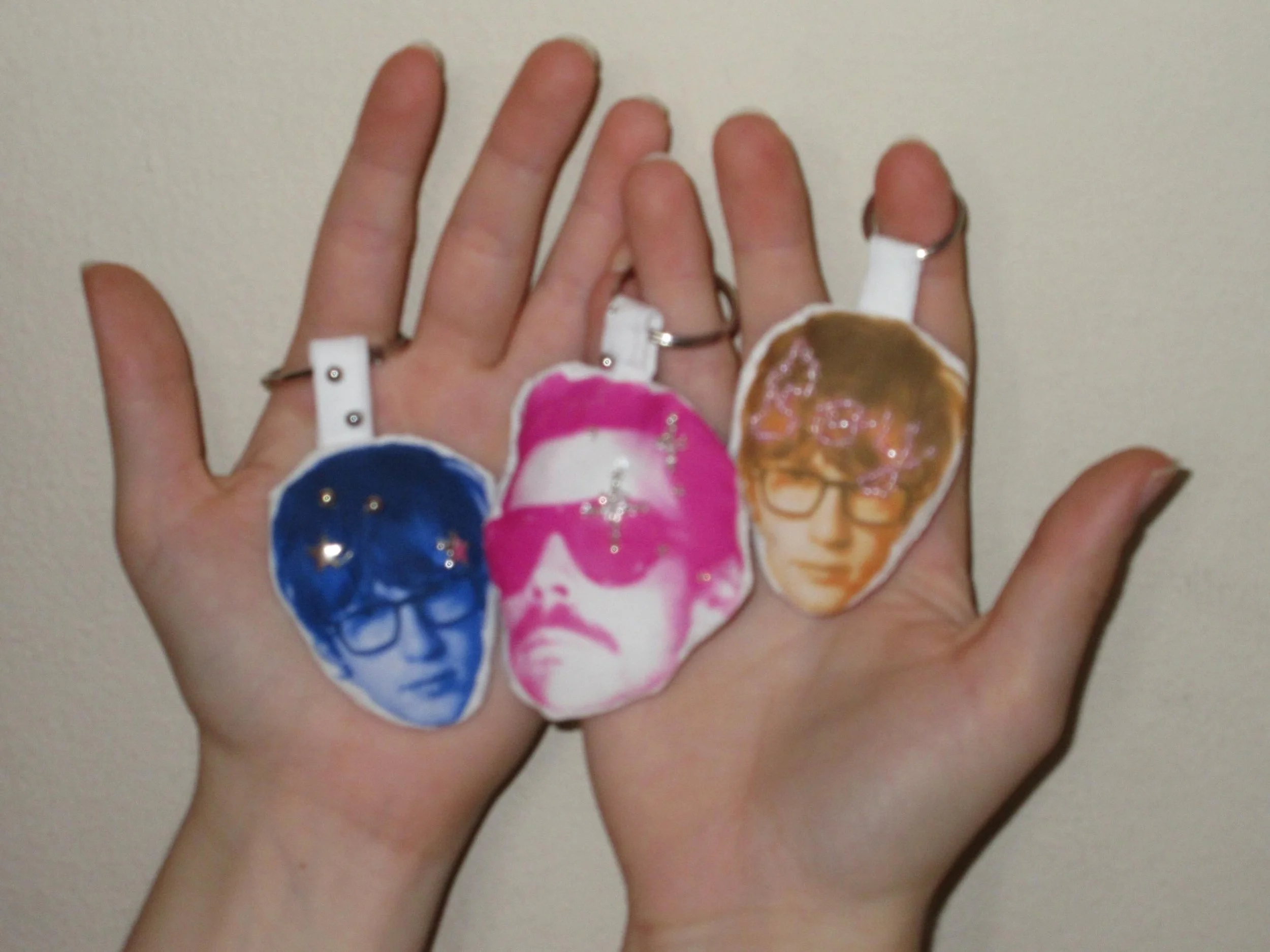 Plush keychains with hand-beaded details. (2026)