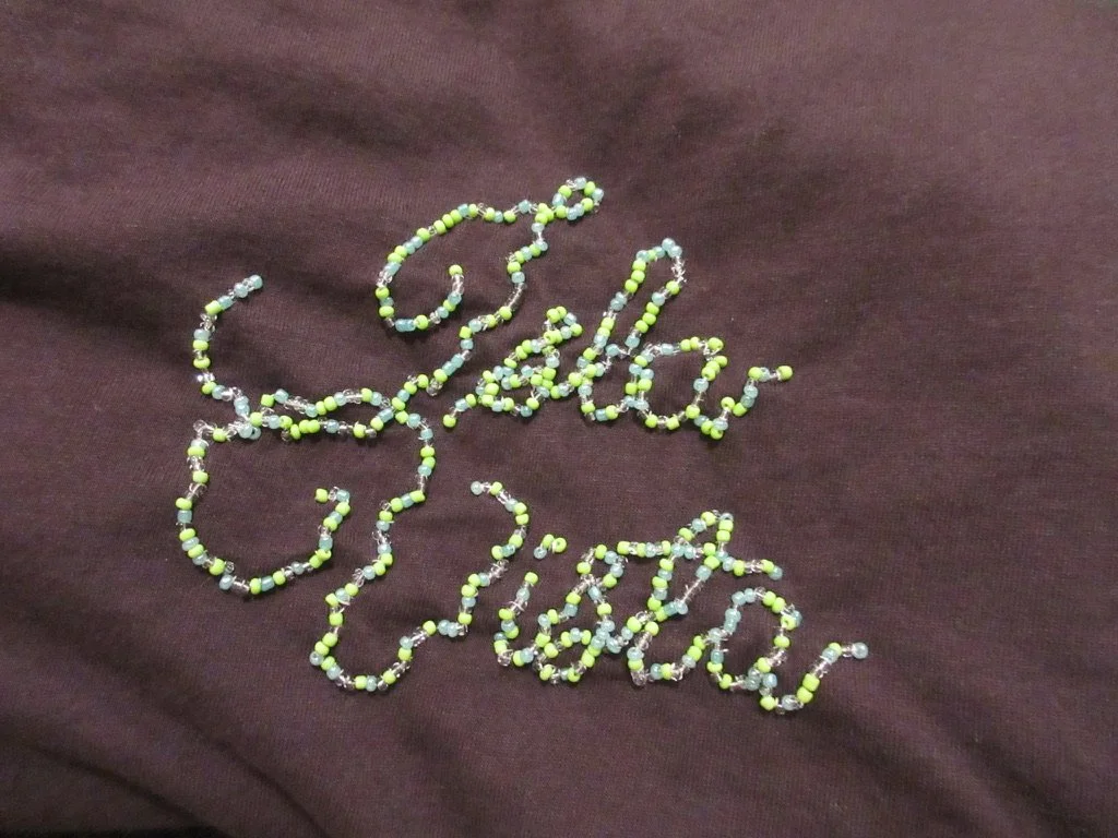Hand-beaded lettering. (2025)
