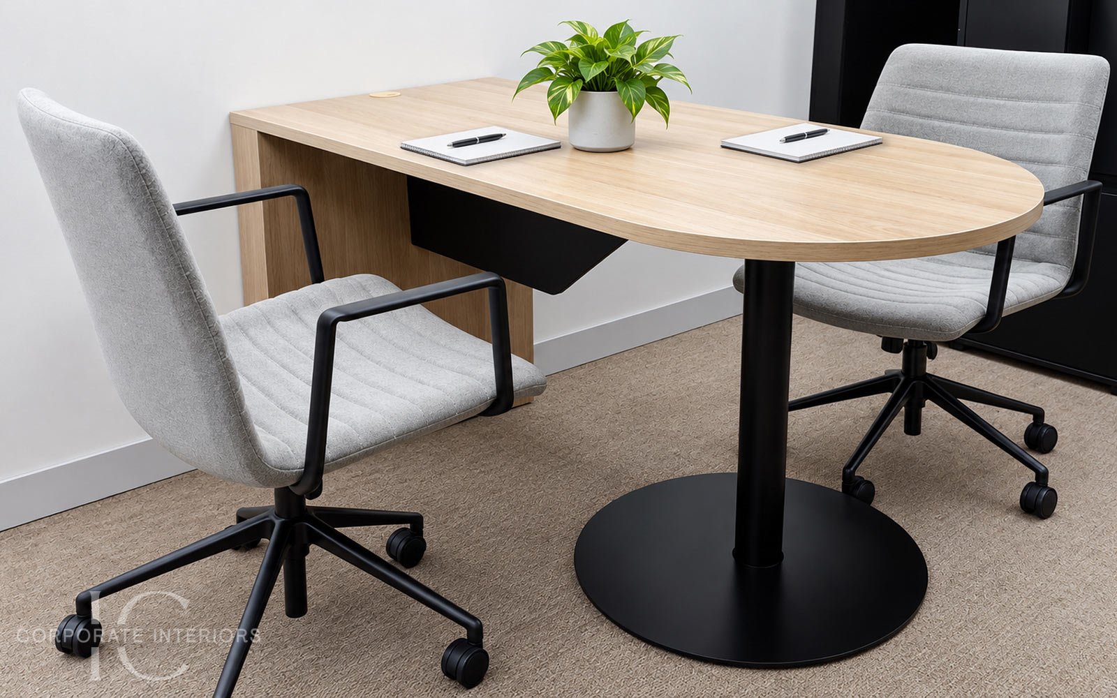 Laminex Classic Oak meeting table with light grey office chairs installed for a commercial office fitout in Forest Hill, Melbourne.