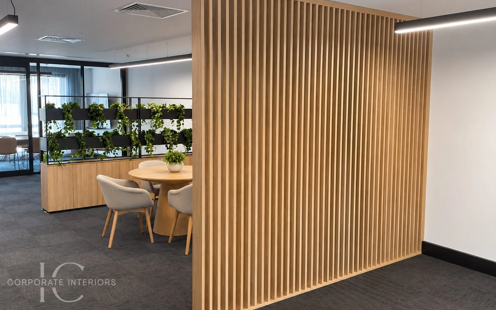 Timber slatted floor-to-ceiling office partition creating separation in a Melbourne workplace