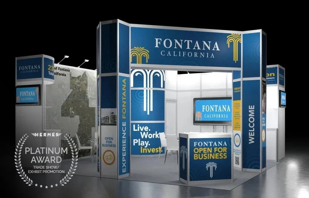 Trade show booth for Fontana, California with branding, a welcome sign, a TV screen, and promotional text like "Live. Work. Play. Invest." and "Open for Business."