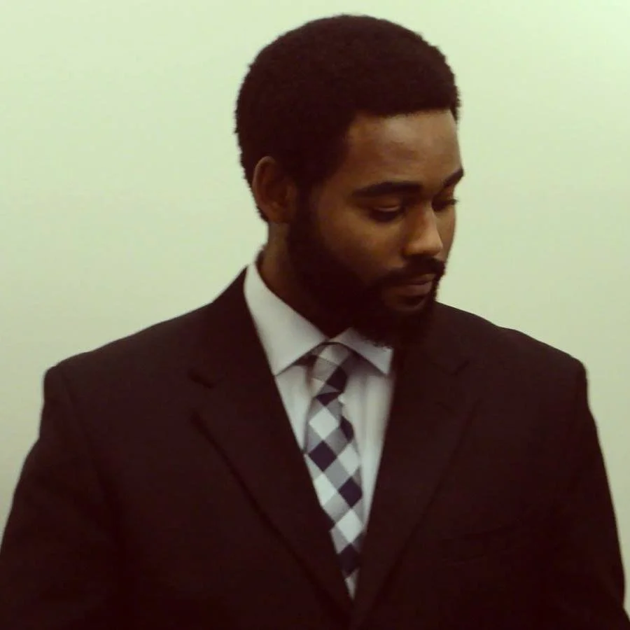 Professional headshot of Wes Banks, aerospace engineer and technology entrepreneur, wearing a suit and tie