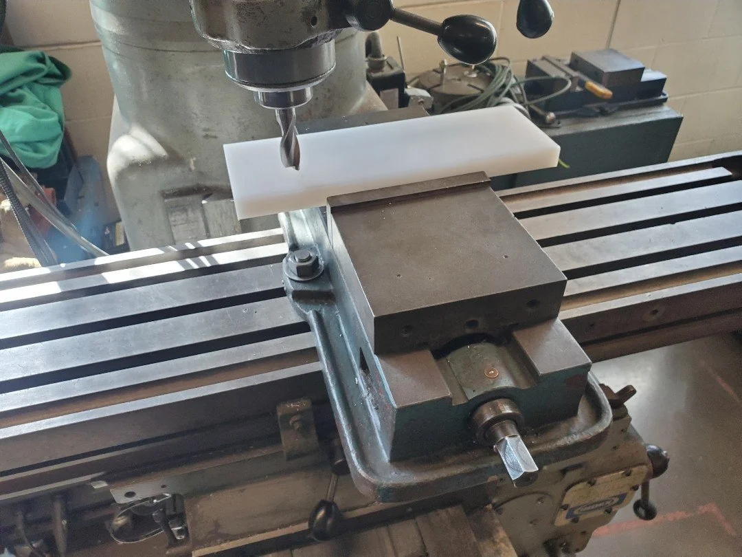 Wes Banks machining a component on a milling machine for a 2D test section assembly
