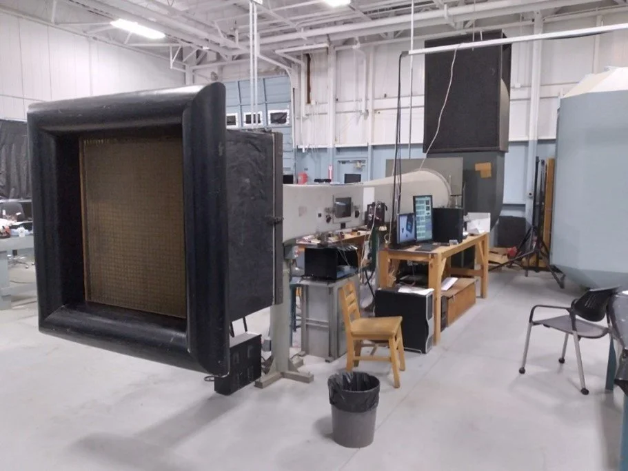 Wes Banks conducting wind tunnel testing on experimental airfoil configurations in the Western Michigan University hangar