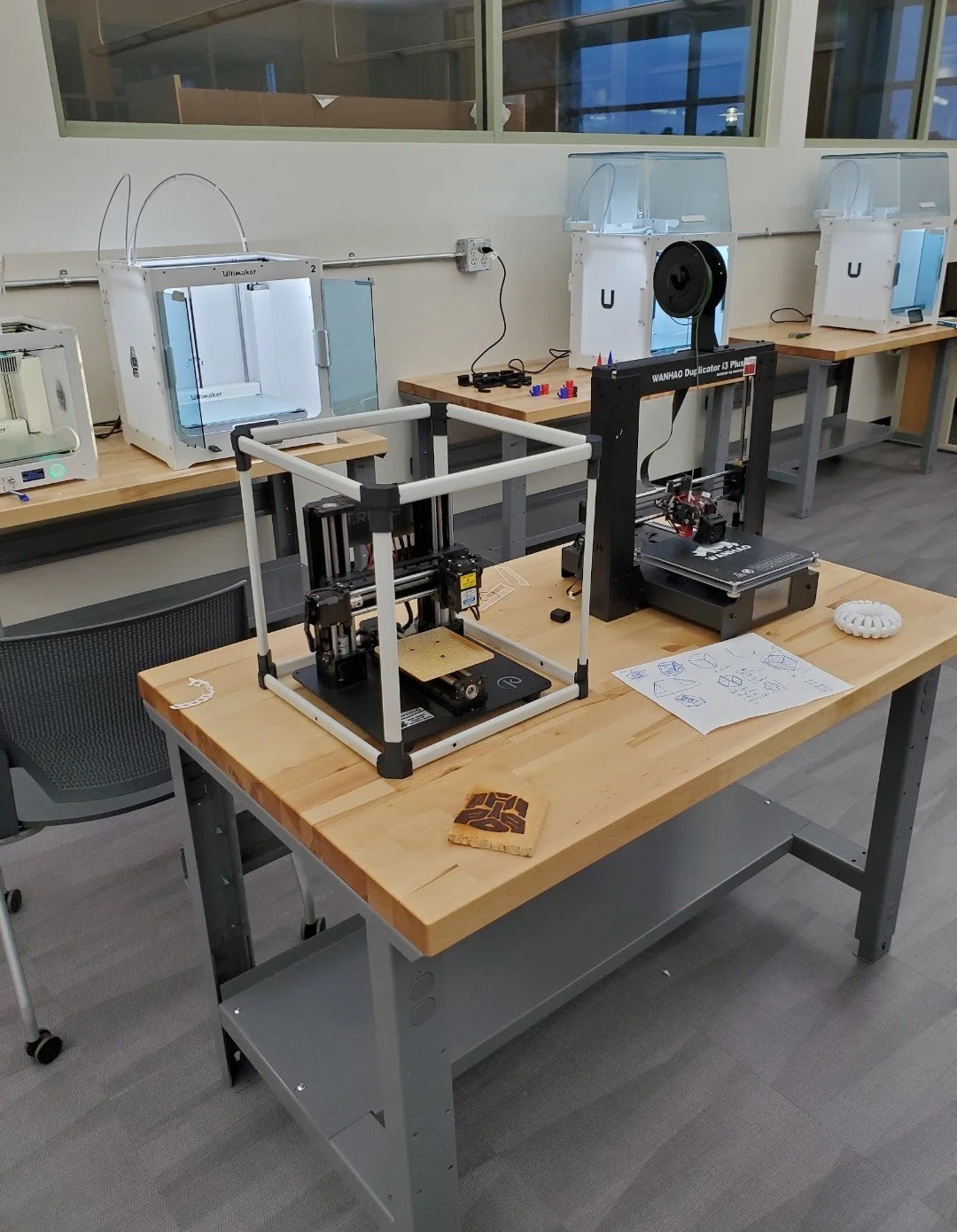 Laser-engraver safety enclosure designed by Wes Banks to provide an additional protective barrier during machine operation
