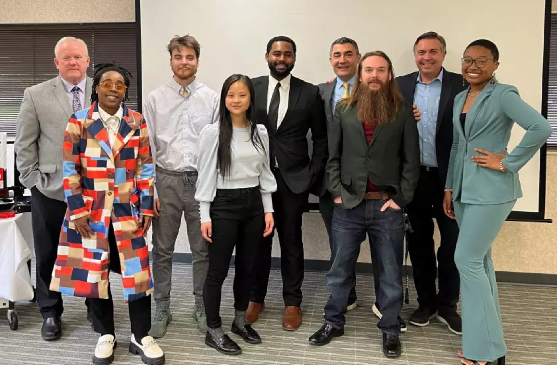 Wes Banks with students and faculty at a university innovation challenge focused on engineering and collaborative problem-solving