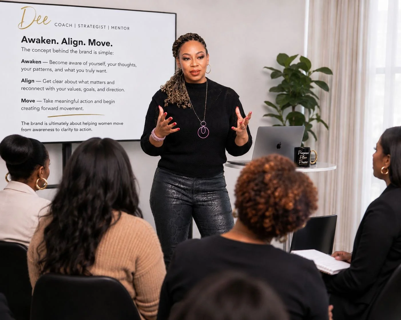 Dee Lockett leading a group coaching session in front of a screen