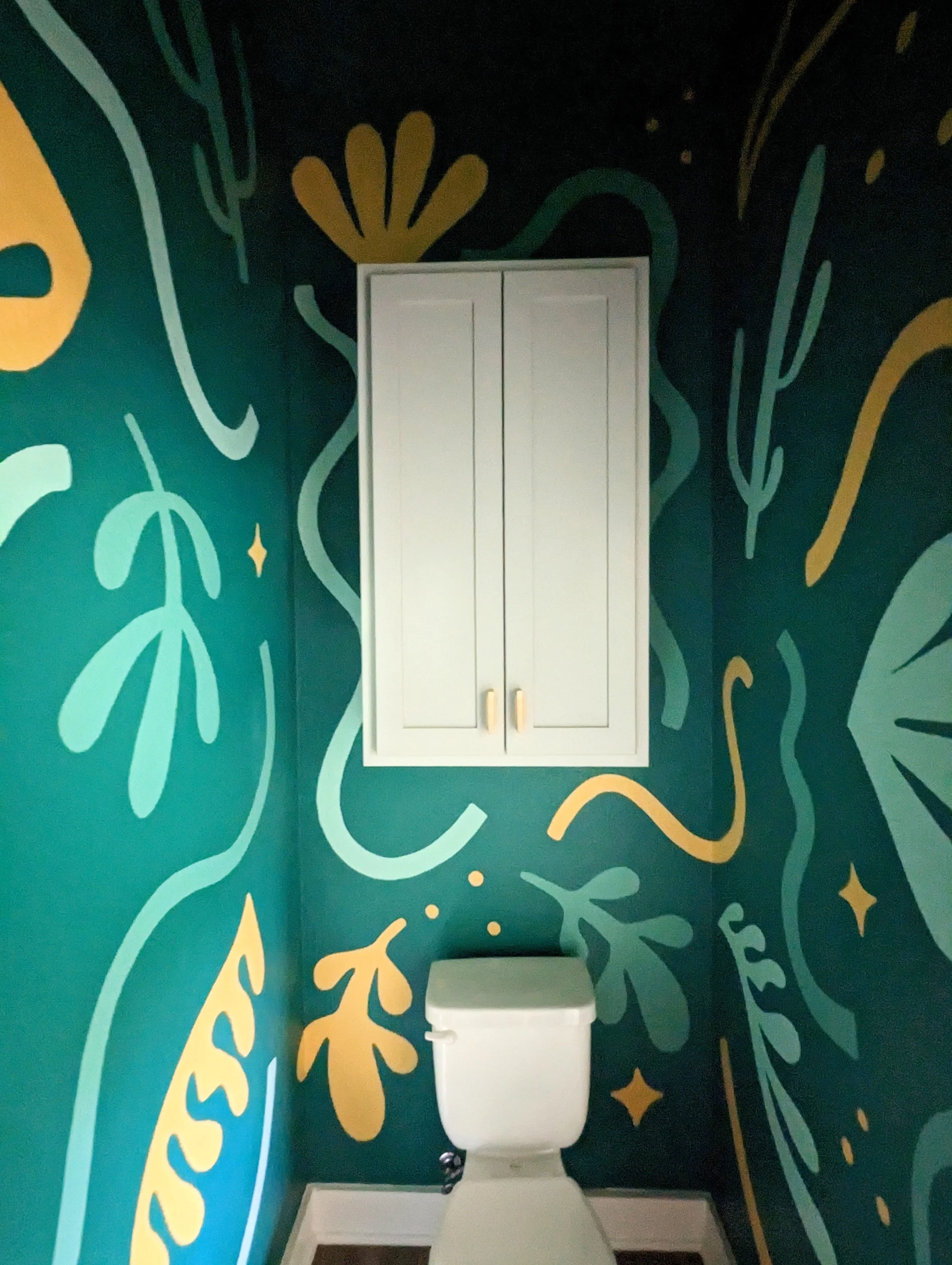 Small Austin powder room bathroom with a jewel-toned mural featuring colorful flowers, organic forms, and sparkling accents.