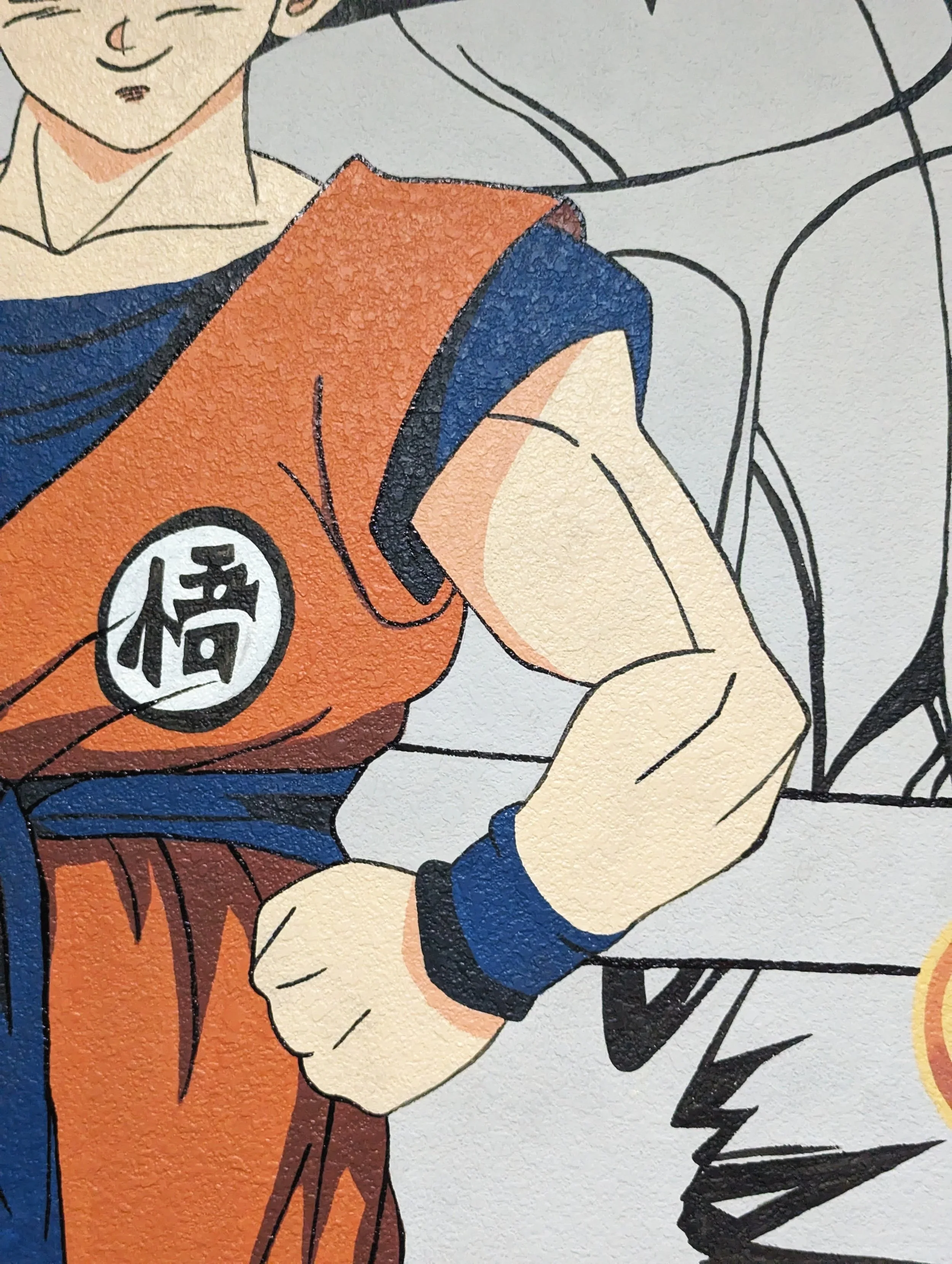 Large Goku mural featuring vibrant Dragon Ball Z artwork layered over black-and-white manga panels in an office in Austin TX.