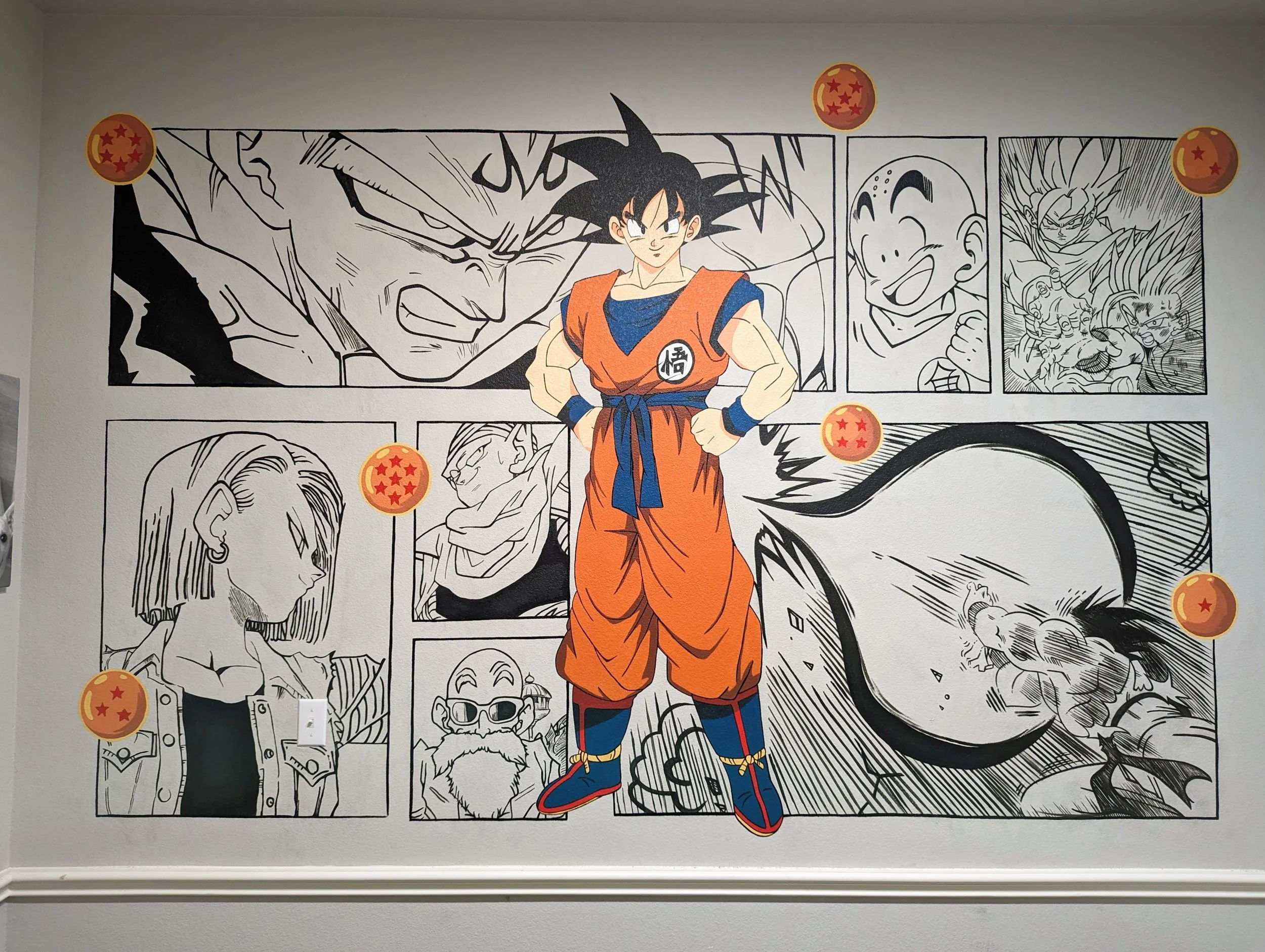 Wall mural featuring characters from Dragon Ball. Centered is Goku in full color, with other characters in black and white manga outlines behind him, and several Dragon Balls in orange with red stars around the mural.
