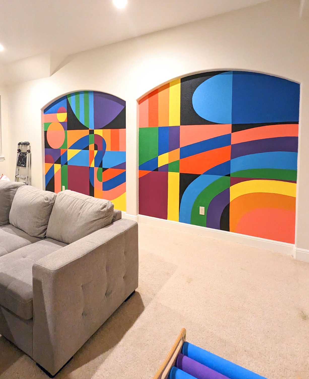 Leander, Texas playroom mural featuring colorful geometric designs painted across two arched wall sections.
