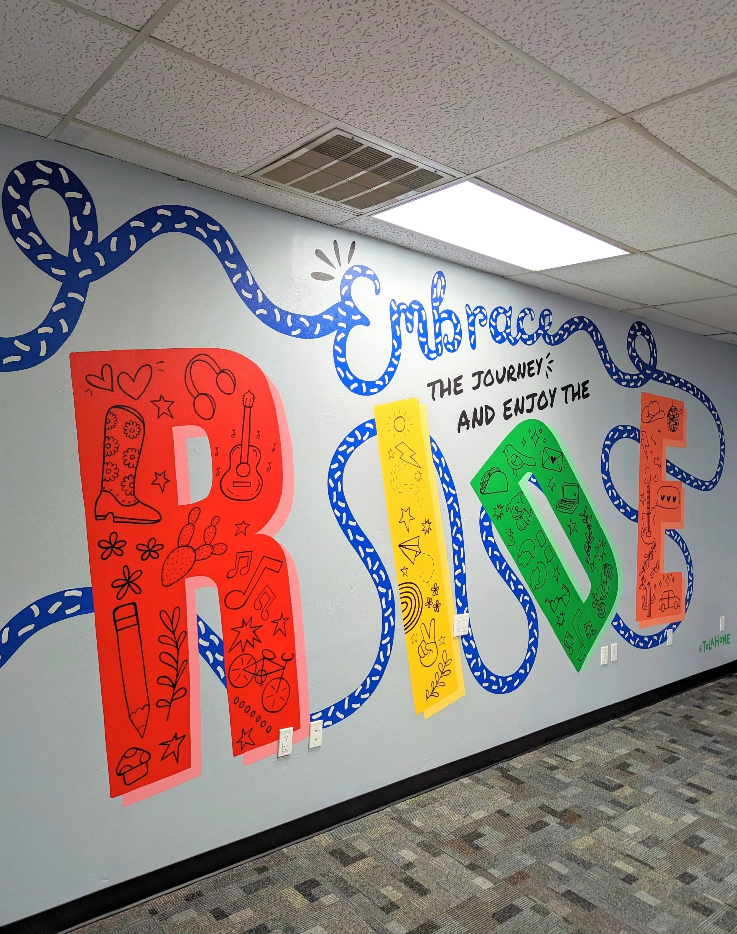 Centex Auto Title office mural in Austin featuring colorful typography and illustrations.