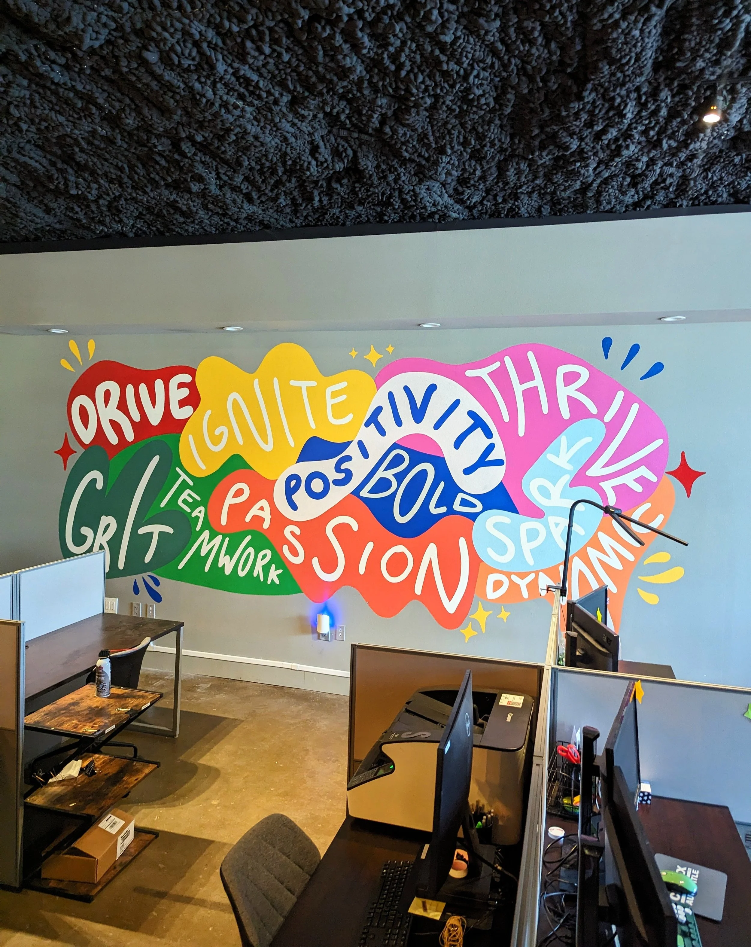 Centex Auto Title office mural in Austin featuring hand-painted typography with company values including drive, positivity, teamwork, and growth.