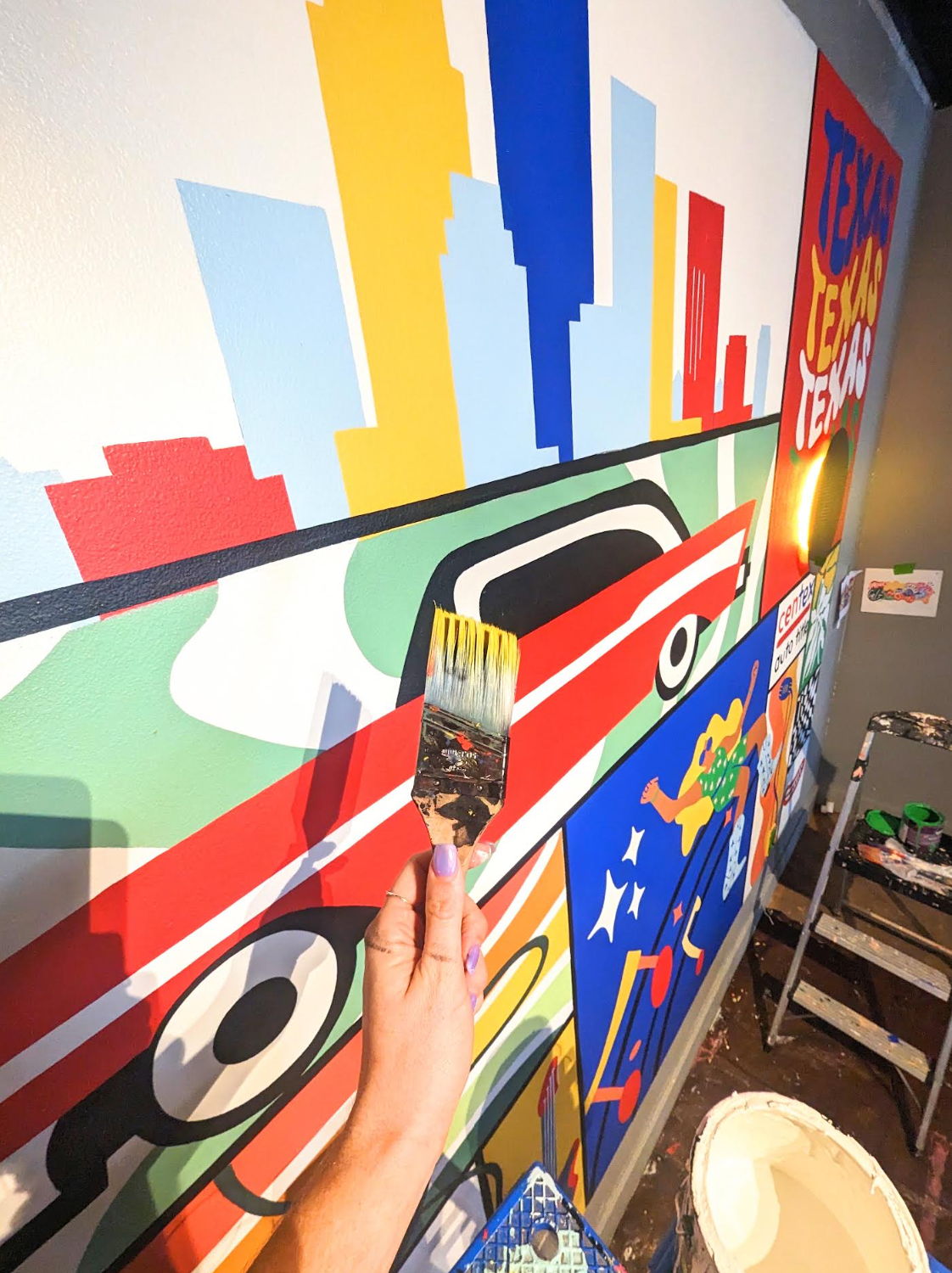 Centex Auto Title office mural in Austin featuring a colorful cityscape, vintage car, boombox, and figurative artwork.
