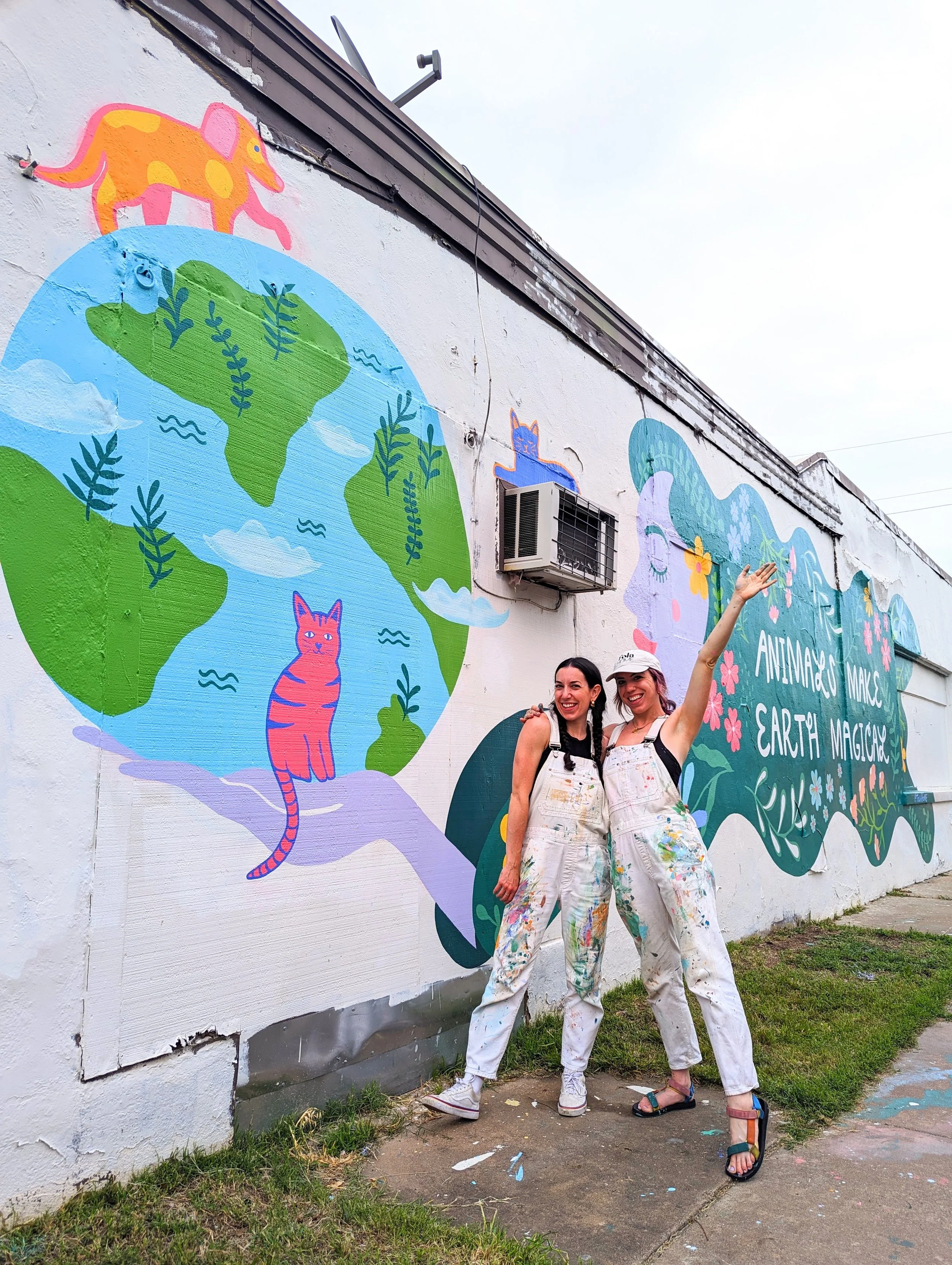 Austin Pets Alive! exterior mural in Austin, Texas featuring animals, flowers, and a globe-inspired design.