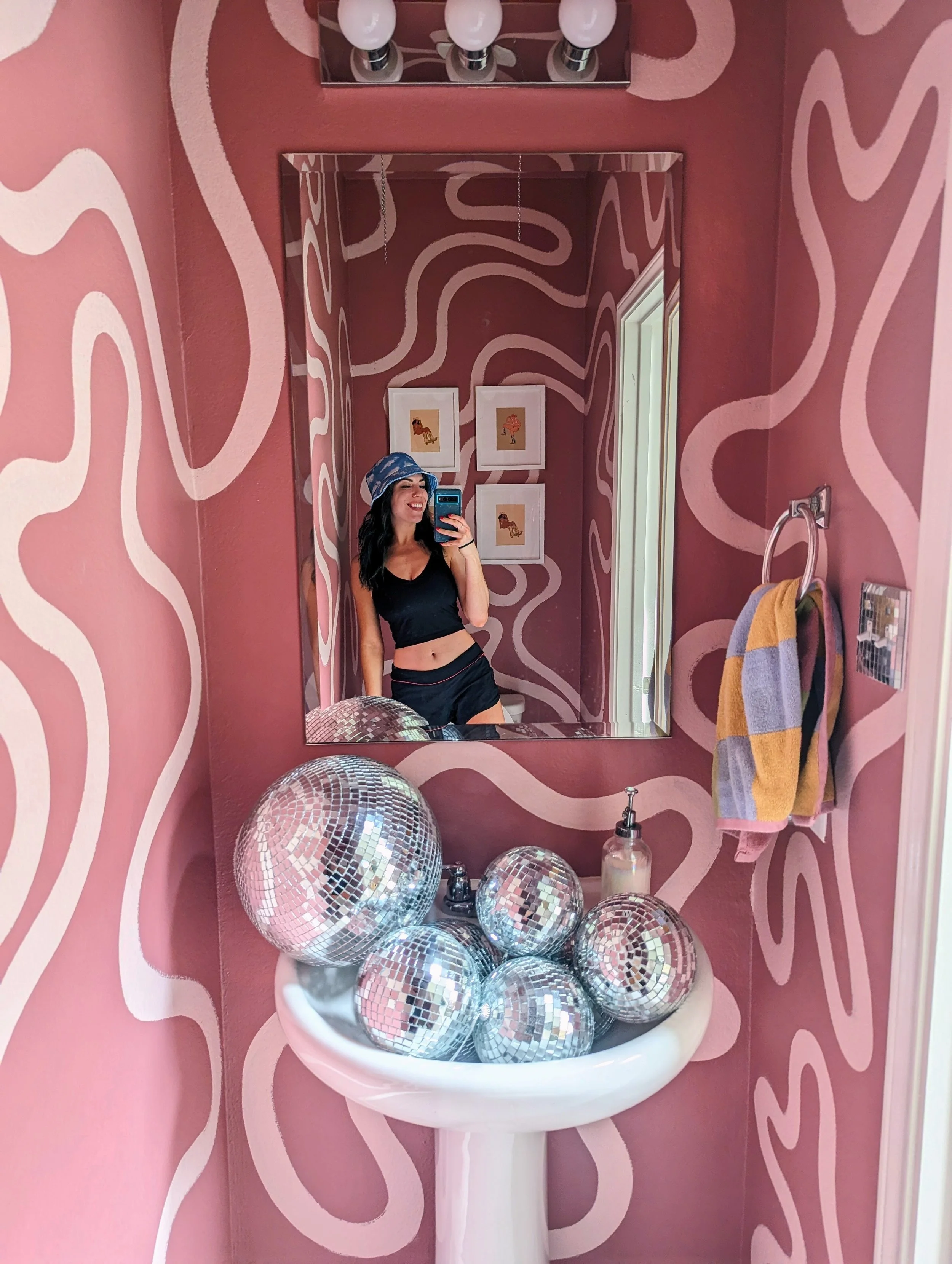 Mauve purple powder room mural in Austin featuring organic shapes, bold curves, and layered purple tones.