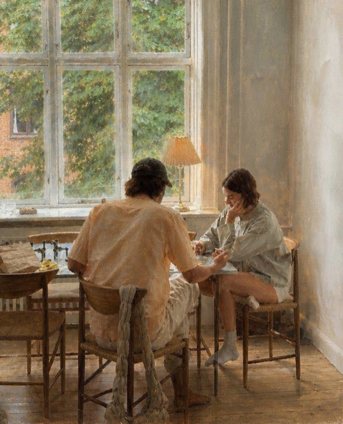 A couple sitting at the dining room table discussing