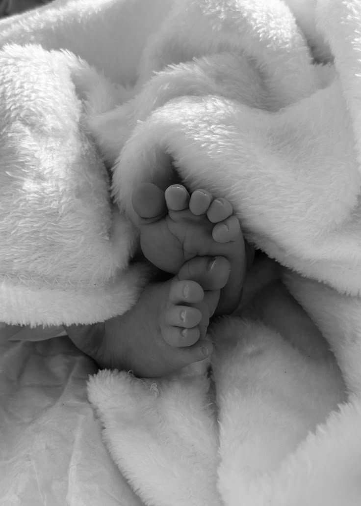 baby feet wrapped in blanket