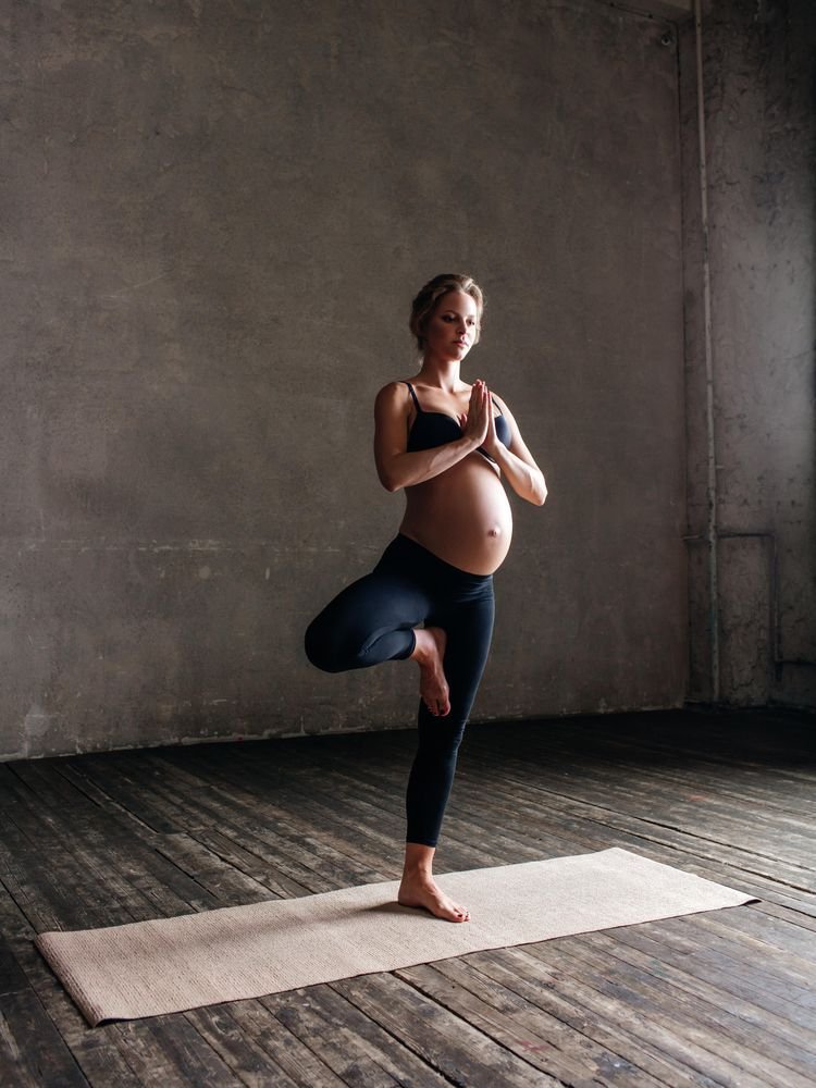 Pregnant woman in yoga pose