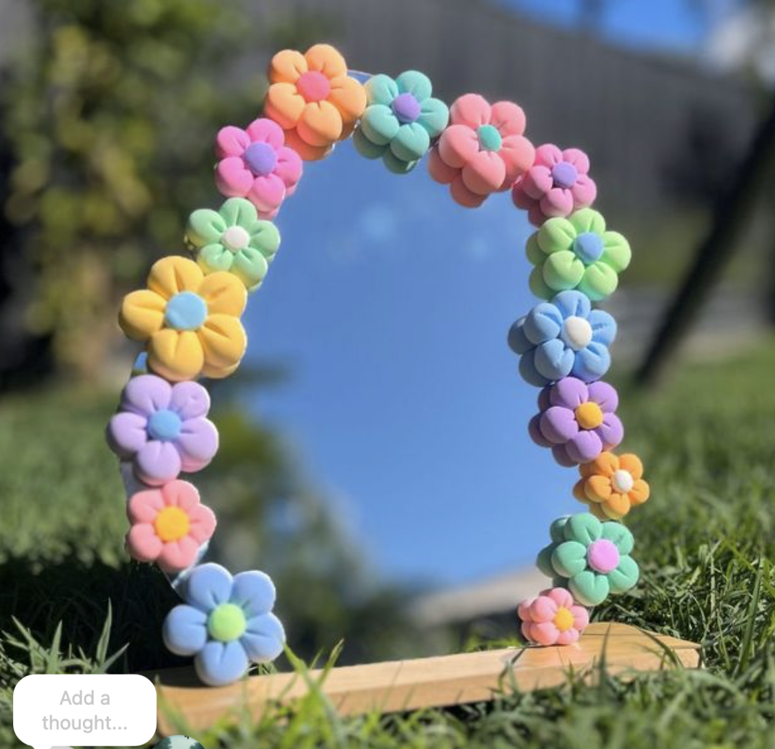 Colorful foam flower floral mirror outdoor background. kids soiree craft activity parties