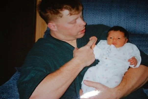 Dad holding baby, This show cases who Sarge's Pudos is named after