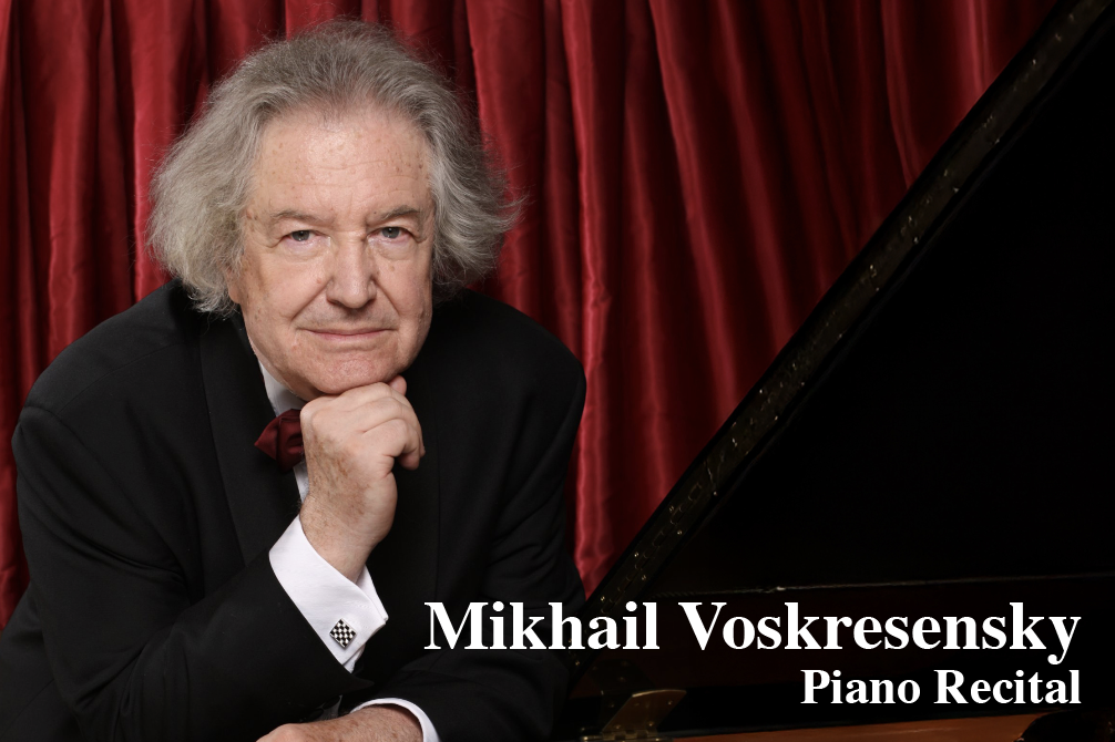 An elderly man with gray hair, wearing a black tuxedo and a red bow tie, sits in front of red curtains with a piano to his side, resting his chin on his hand, with text indicating it's Mikhail Voskresensky for a piano recital.