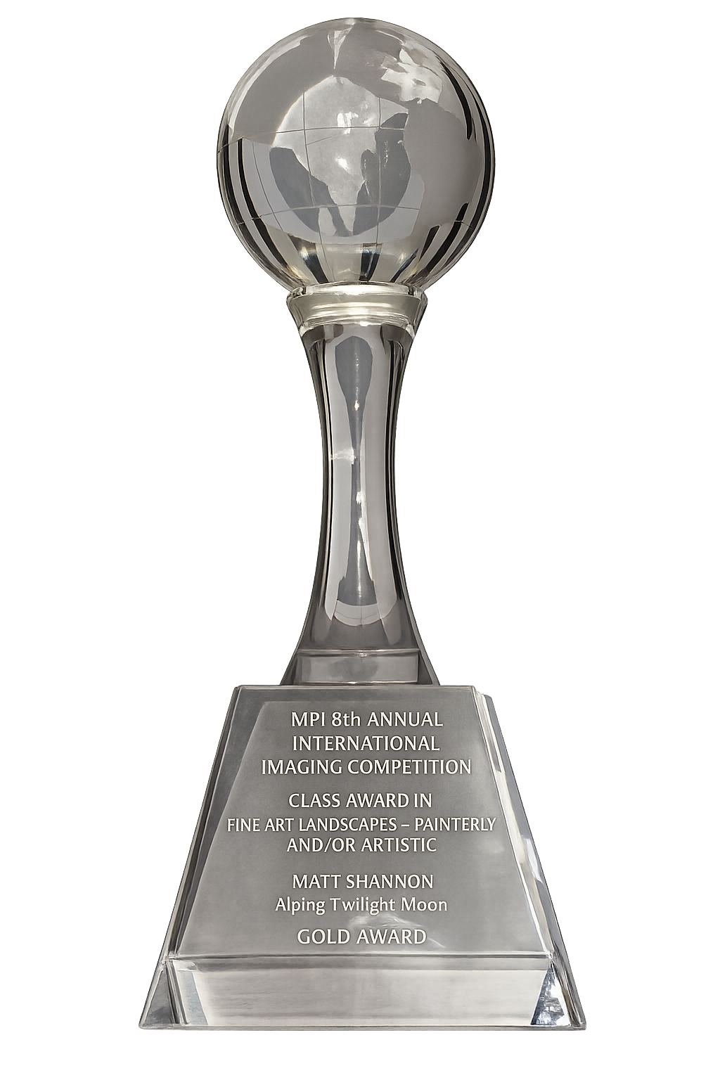 A glass trophy with a globe on top, inscribed with details about the MPI 8th Annual International Imaging Competition, a landscape art award won by Matt Shannon for 'Alping Twilight Moon'.
