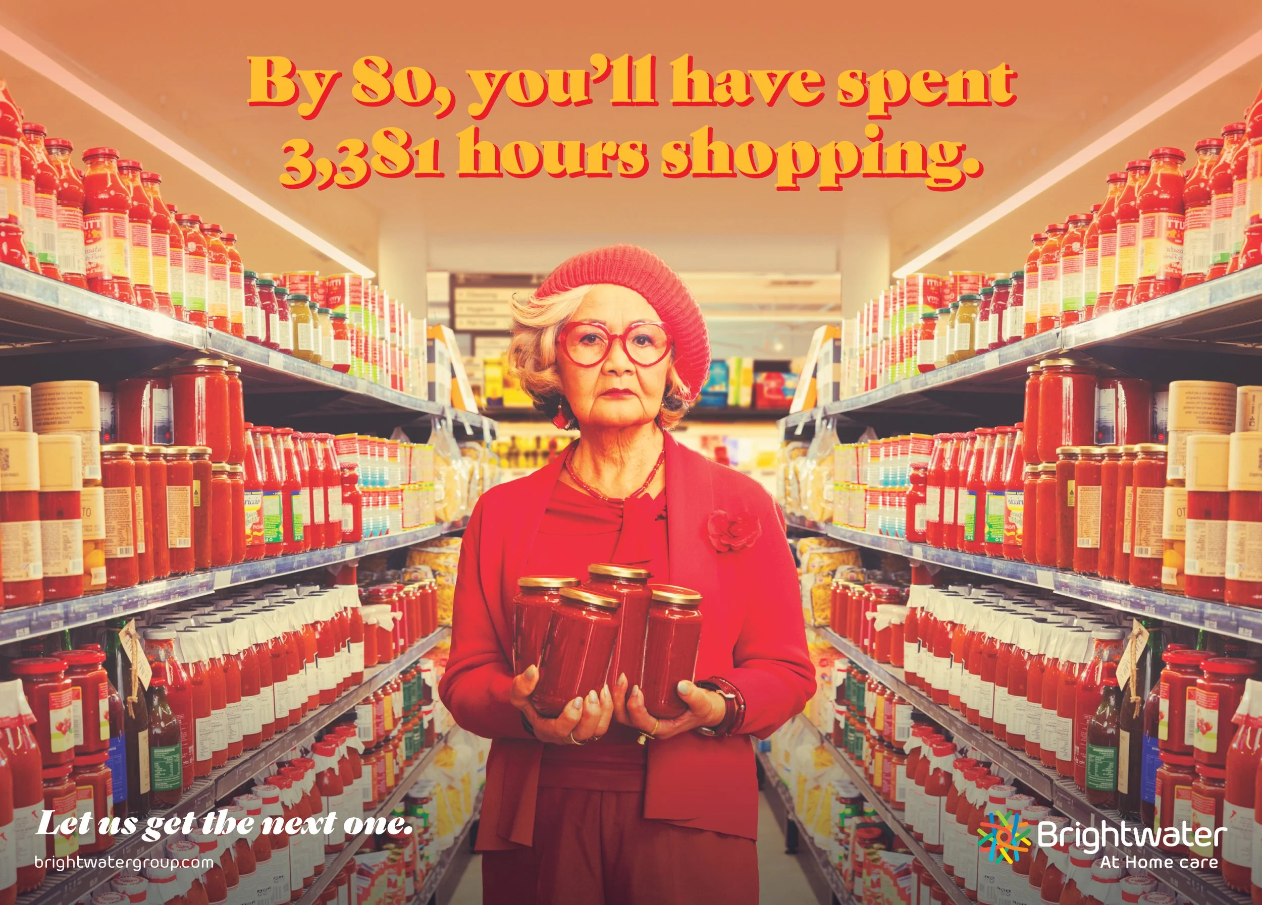 An elderly woman with glasses and a red hat shopping for canned goods in a grocery store aisle, holding several cans. The image includes text that says, 'By 80, you'll have spent 3,381 hours shopping.'