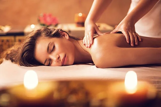 Woman receiving a massage in a peaceful spa setting