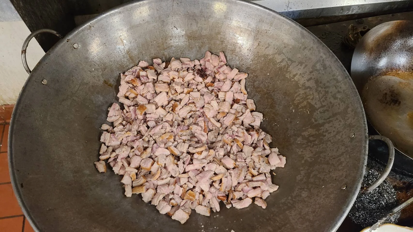 Taiwanese braised pork preparation - in large wok.