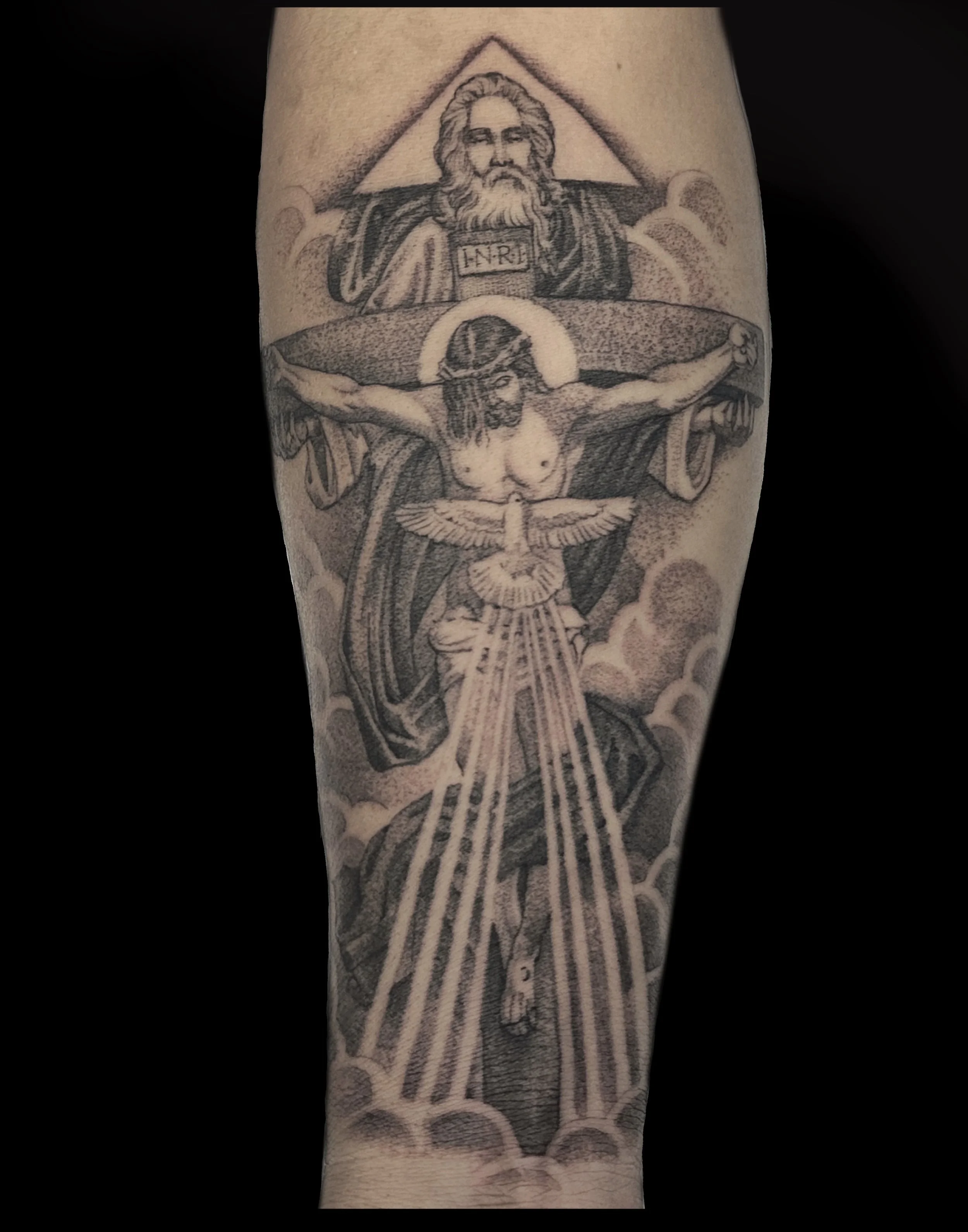 Tattoo illustration of Jesus Christ carrying a heavy cross, with a glowing halo around his head, set against a background with clouds.