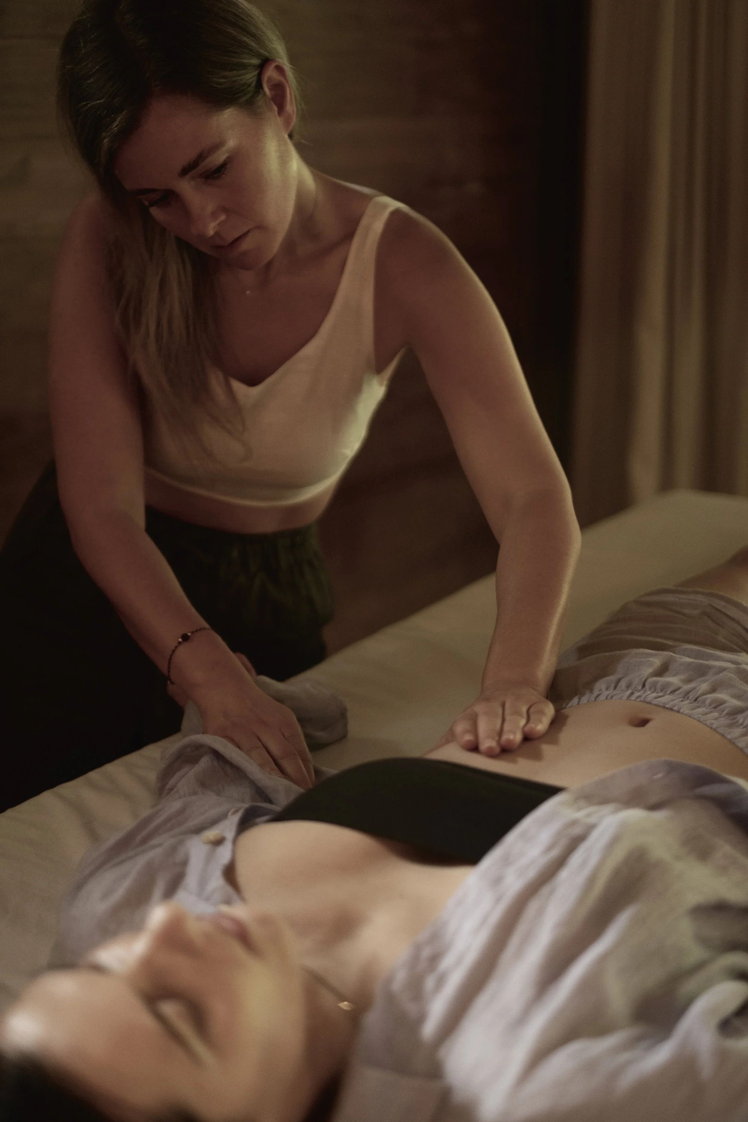 Alex providing hands-on breathwork facilitation during an FBR session.