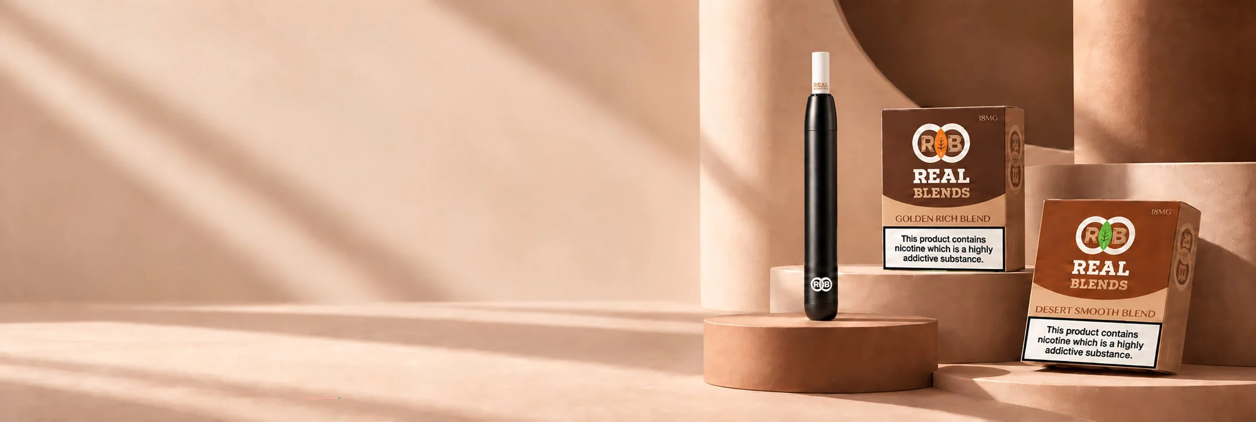 Display of two boxes of REAL Blends nicotine products, one labeled Golden Rich Blend and the other Desert Smooth Blend, with a vaping device positioned between them on a beige backdrop.