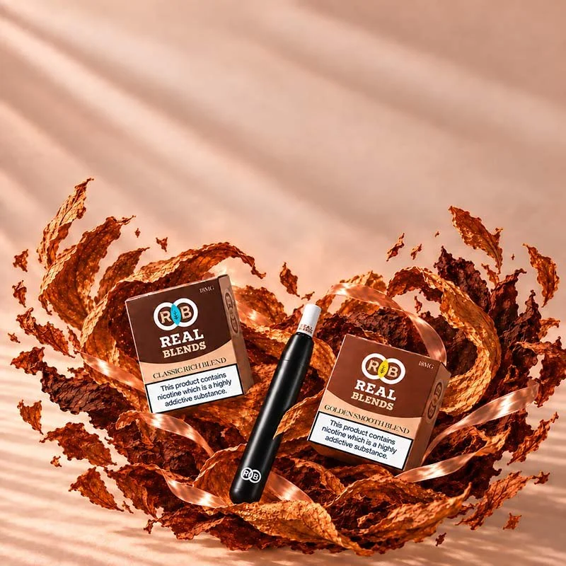 Vape pen with two boxes of R&B Real Blends cannabis products inside a decorative brown paper bowl on a wooden surface.