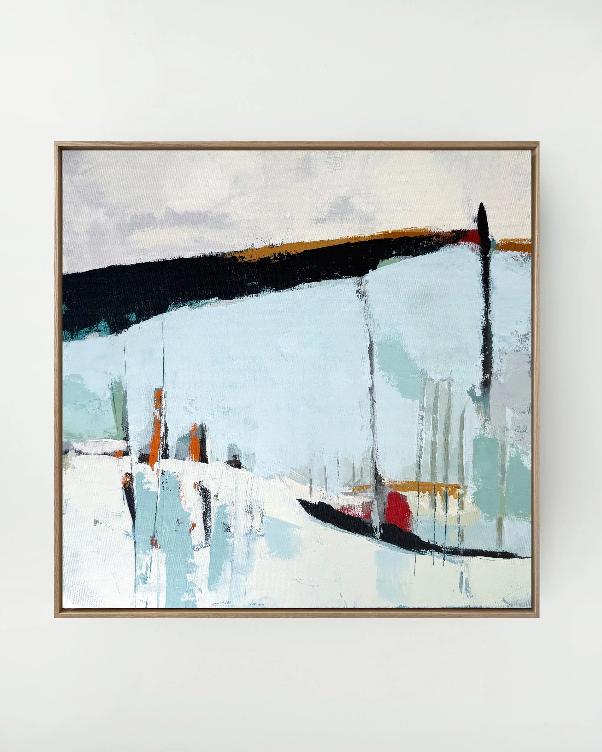 Abstract modern painting with a large black curved line and colorful drips on a mostly white and gray background, framed in a light wood frame.