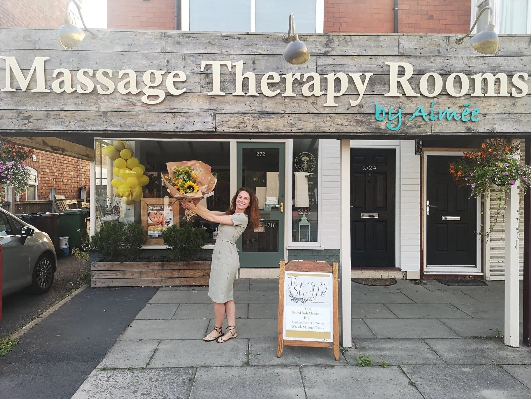 Massage Therapy Rooms business owner, standing in front of her shop Liverpool Road, Birkdale, celebrating 11 years in business. A business specialising in deep tissue massage, lymphatic drainage massage, pregnancy massage, Organic Holistic facials.
