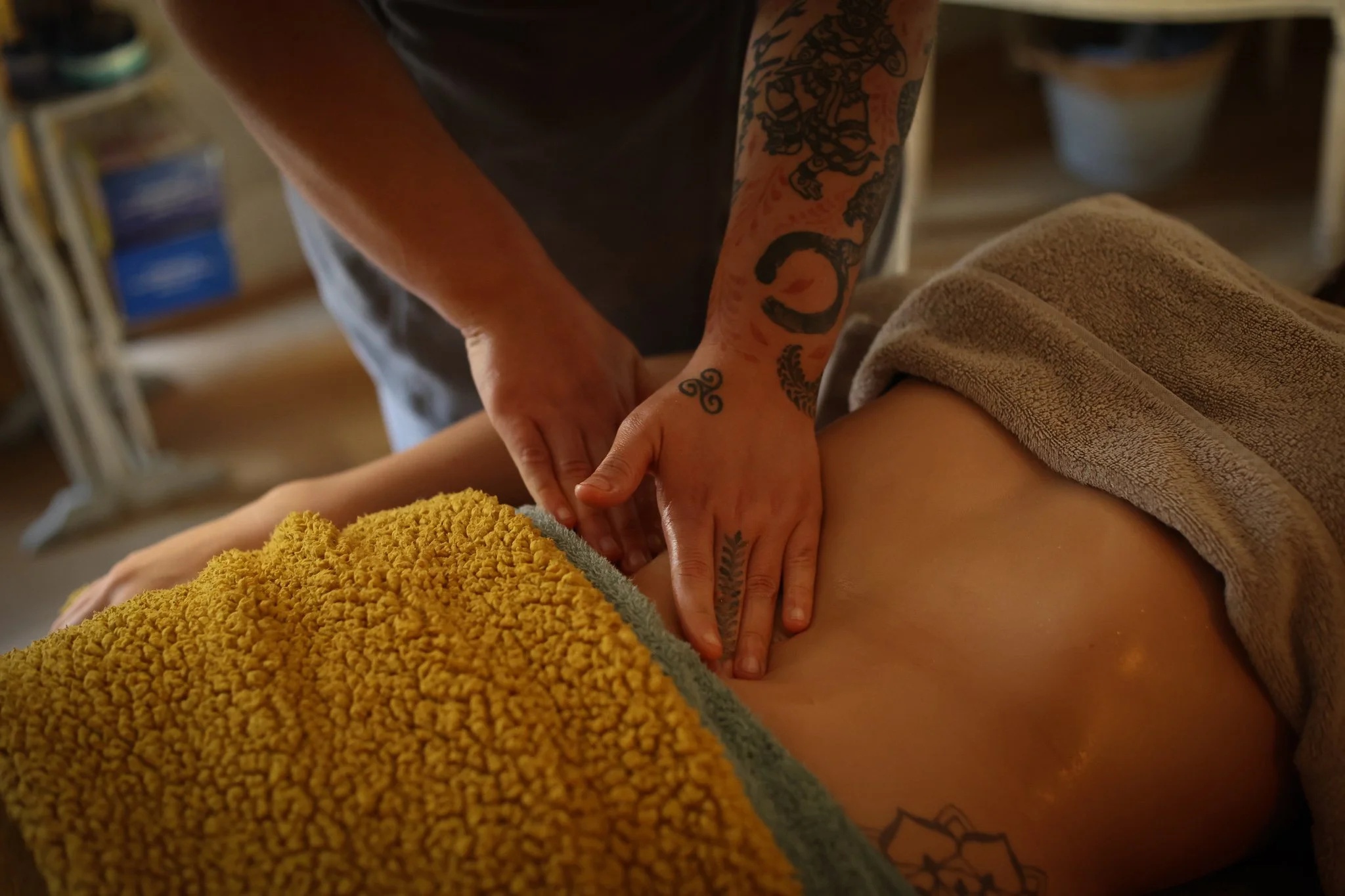 A person having an abdominal massage to help with digestion, IBS and bloating. Also used in lymphatic drainage massage.