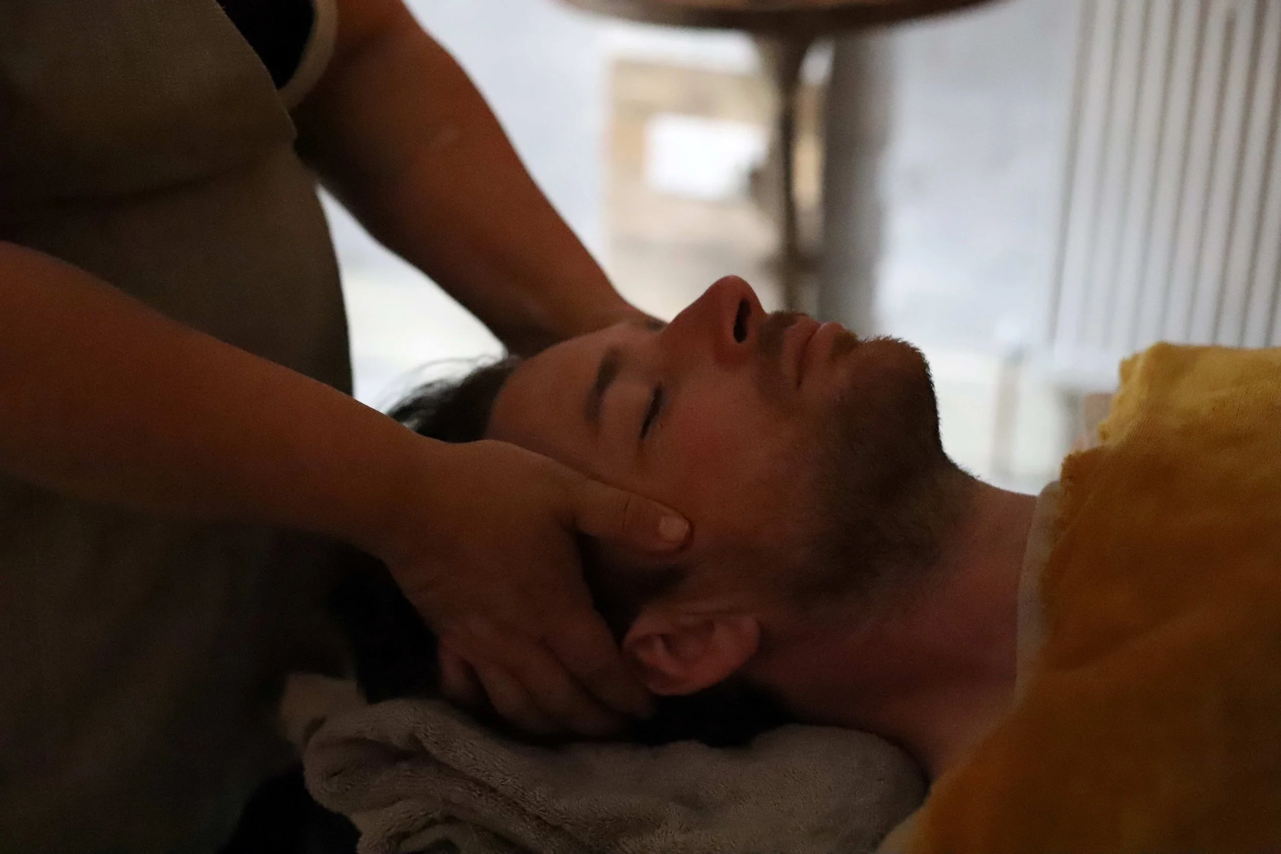 A person having an Indian Head Massage and Reiki.