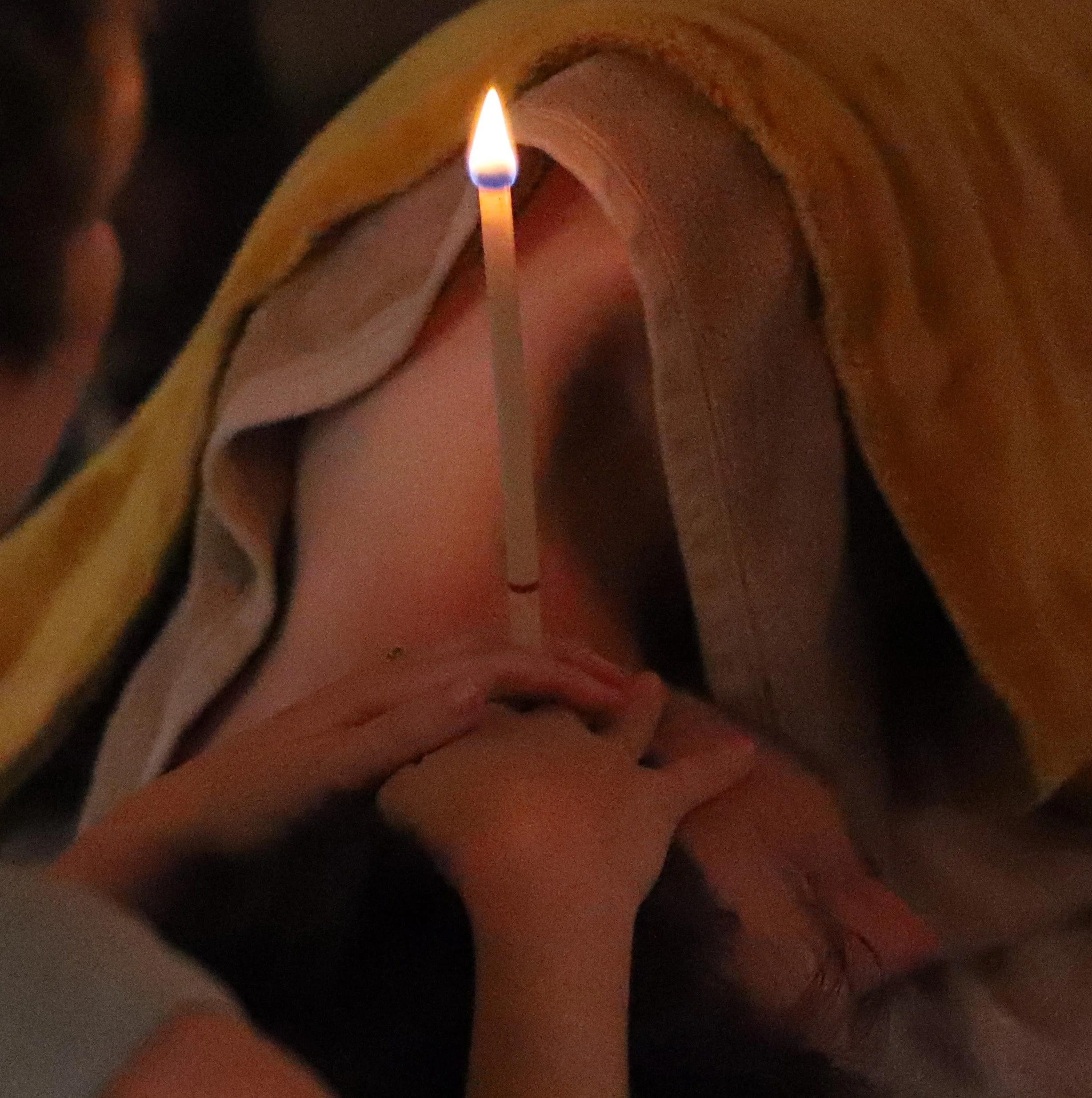 A lady having a session of Hopi Ear Candles to remove built up ear wax, help tinitus and relieve sinus congestion.