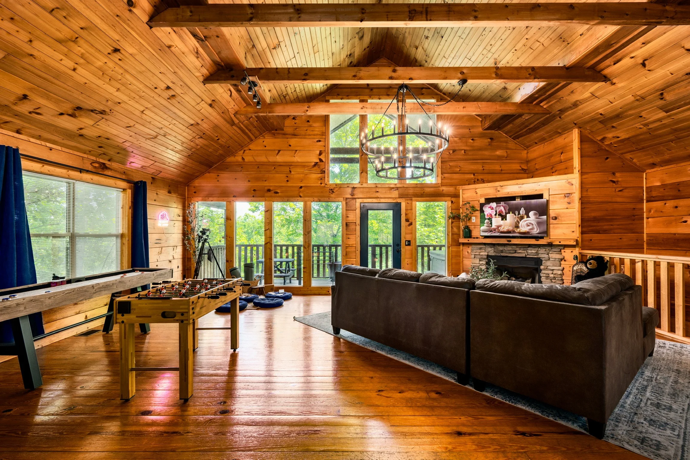 Blue Sage Hideaway living room with foosball table and vaulted wood ceiling
