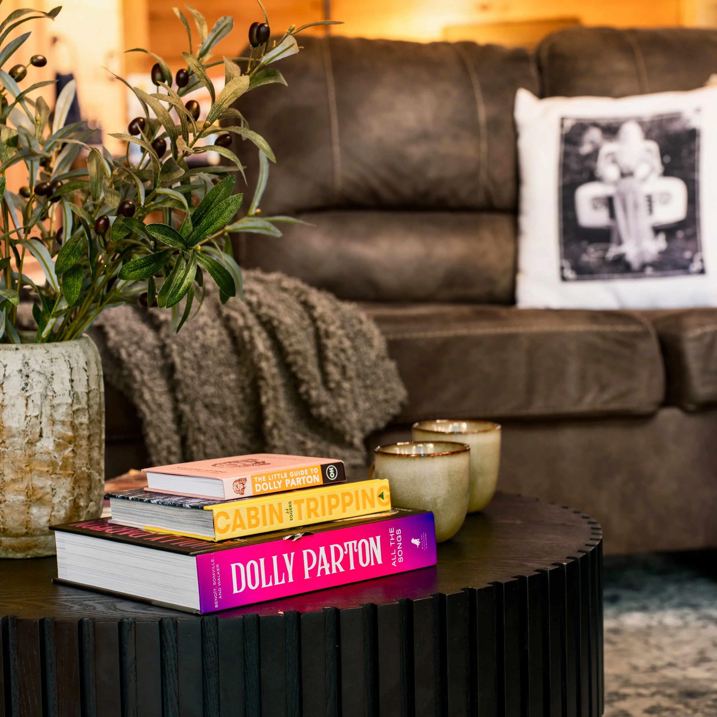Every corner of Blue Sage has a little Dolly in it. 🦋
Songbooks on the coffee table, her face on the throw pillows, and her music on the record player. We filled the cabin with her because you can't stay in these mountains without feeling her everyw